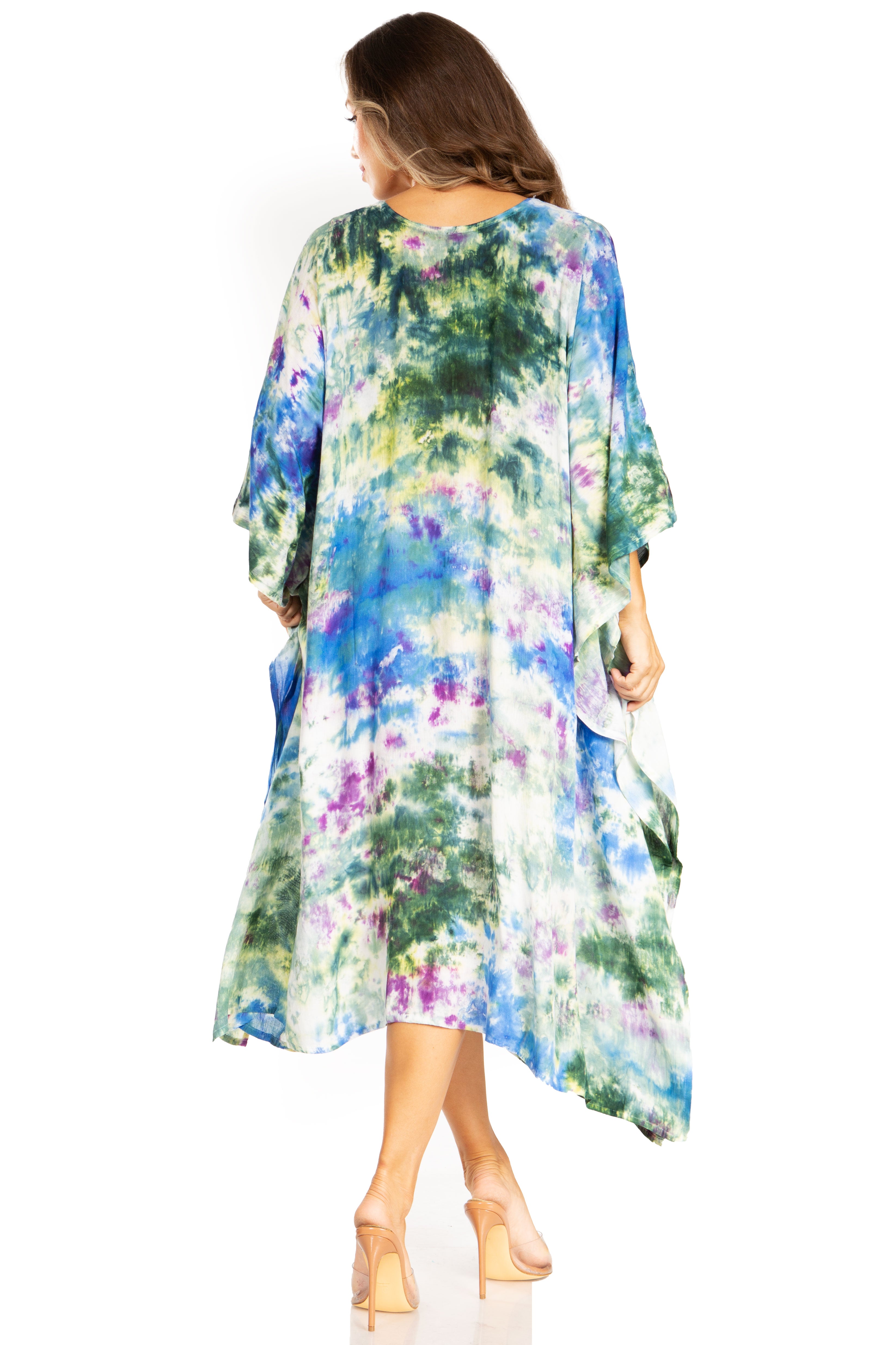 Woman wearing a colorful floral dress on a white background