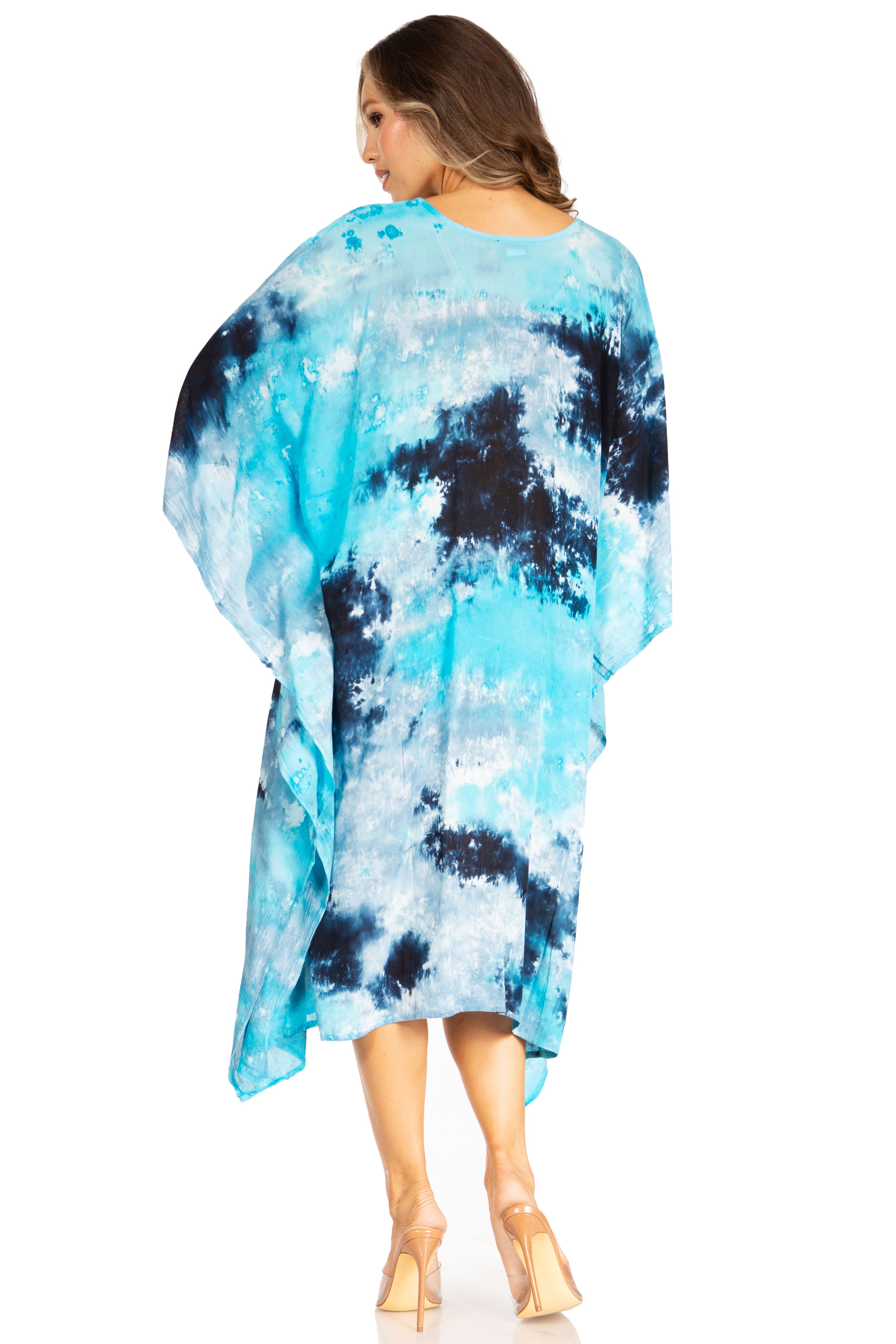 Woman wearing a blue and black tie-dye dress on a white background