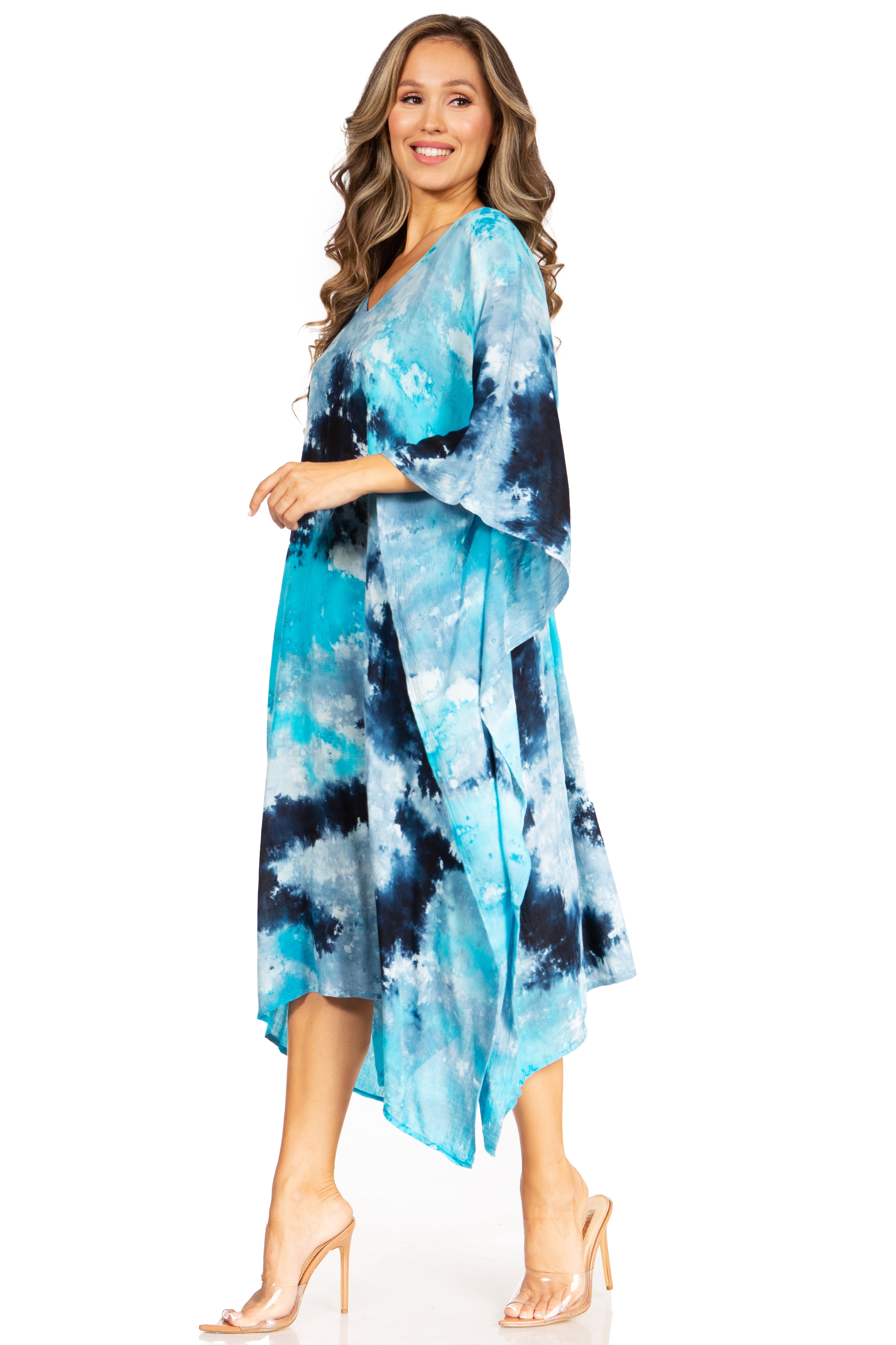 Woman wearing a blue and black tie-dye dress on a white background