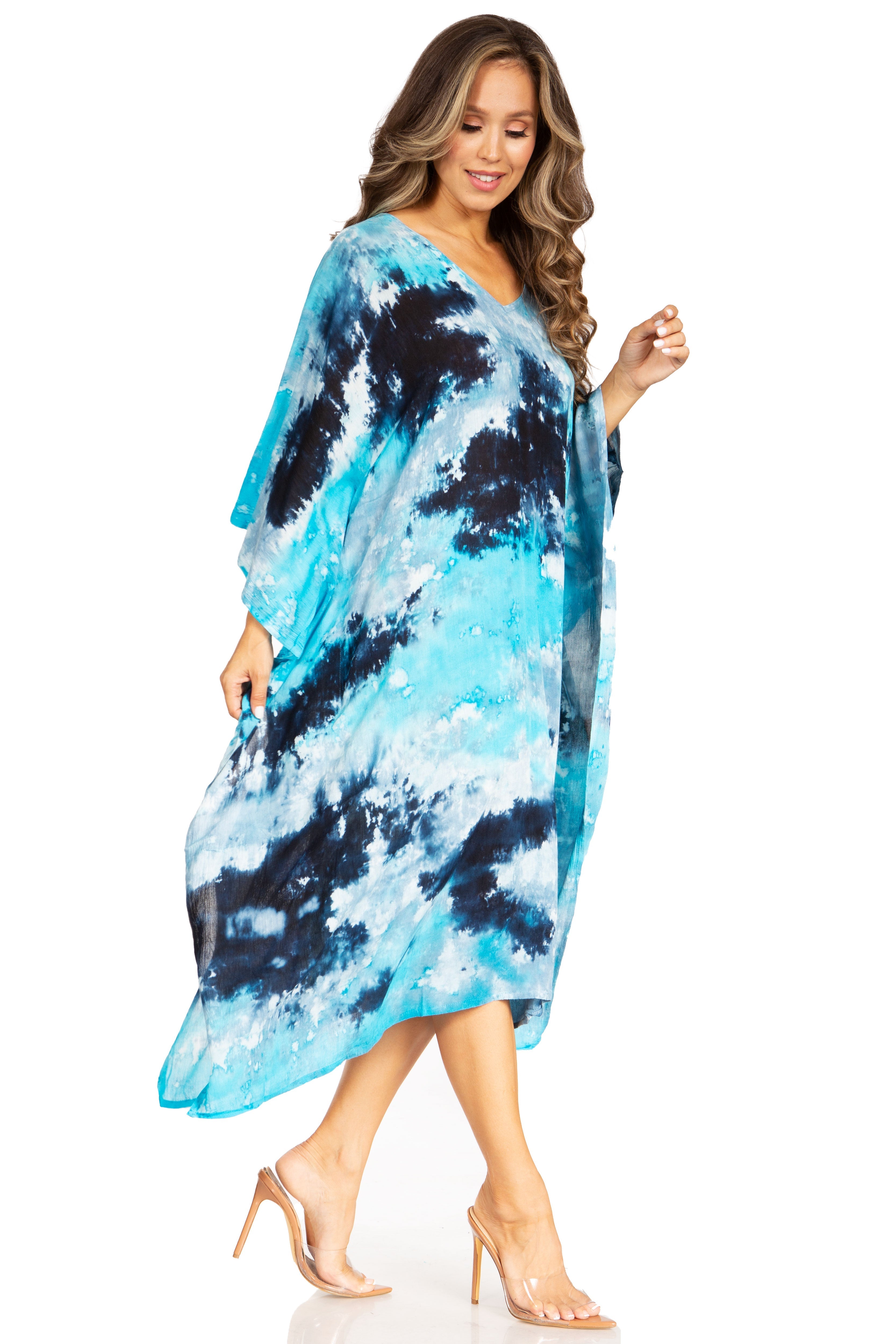 Woman wearing a blue and black tie-dye dress on a white background