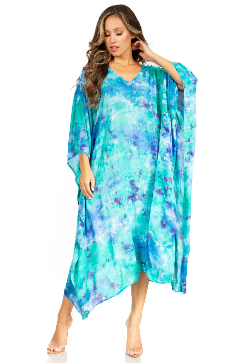 Woman wearing a colorful, tie-dye dress on a white background
