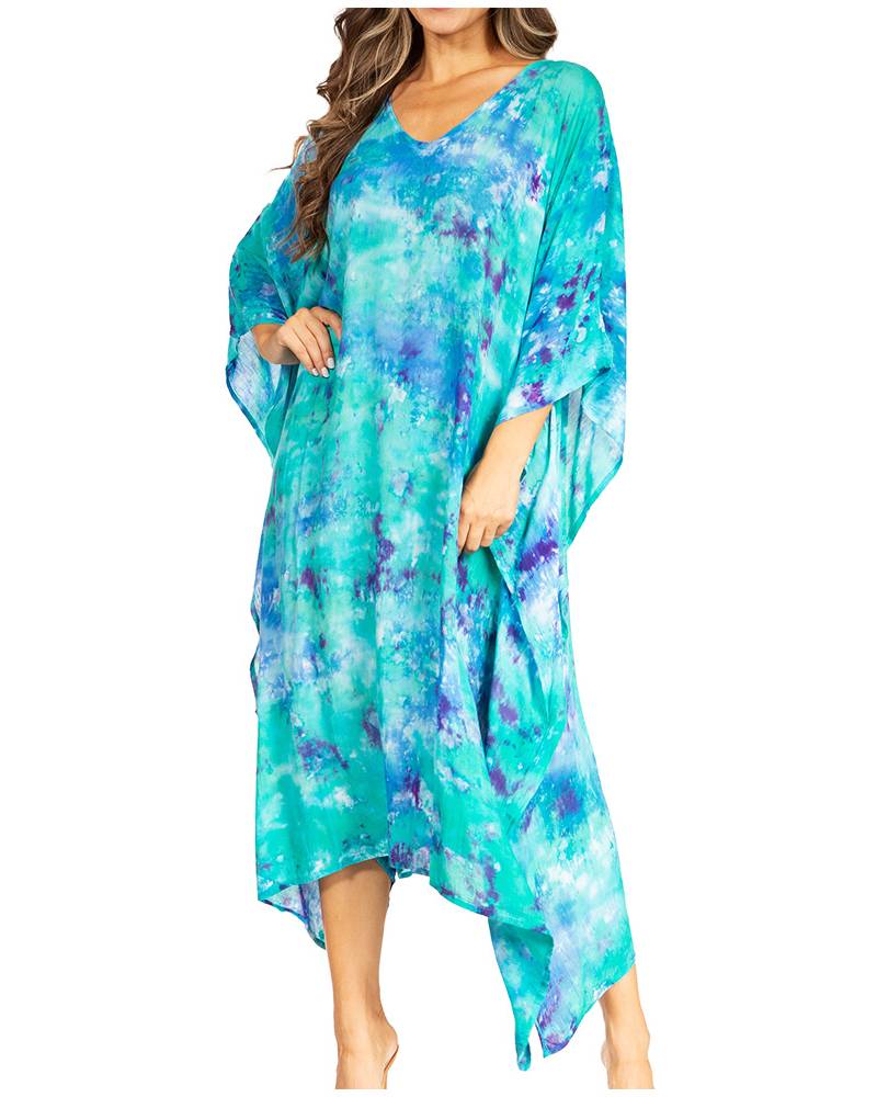 Woman wearing a blue and green floral dress on a white background