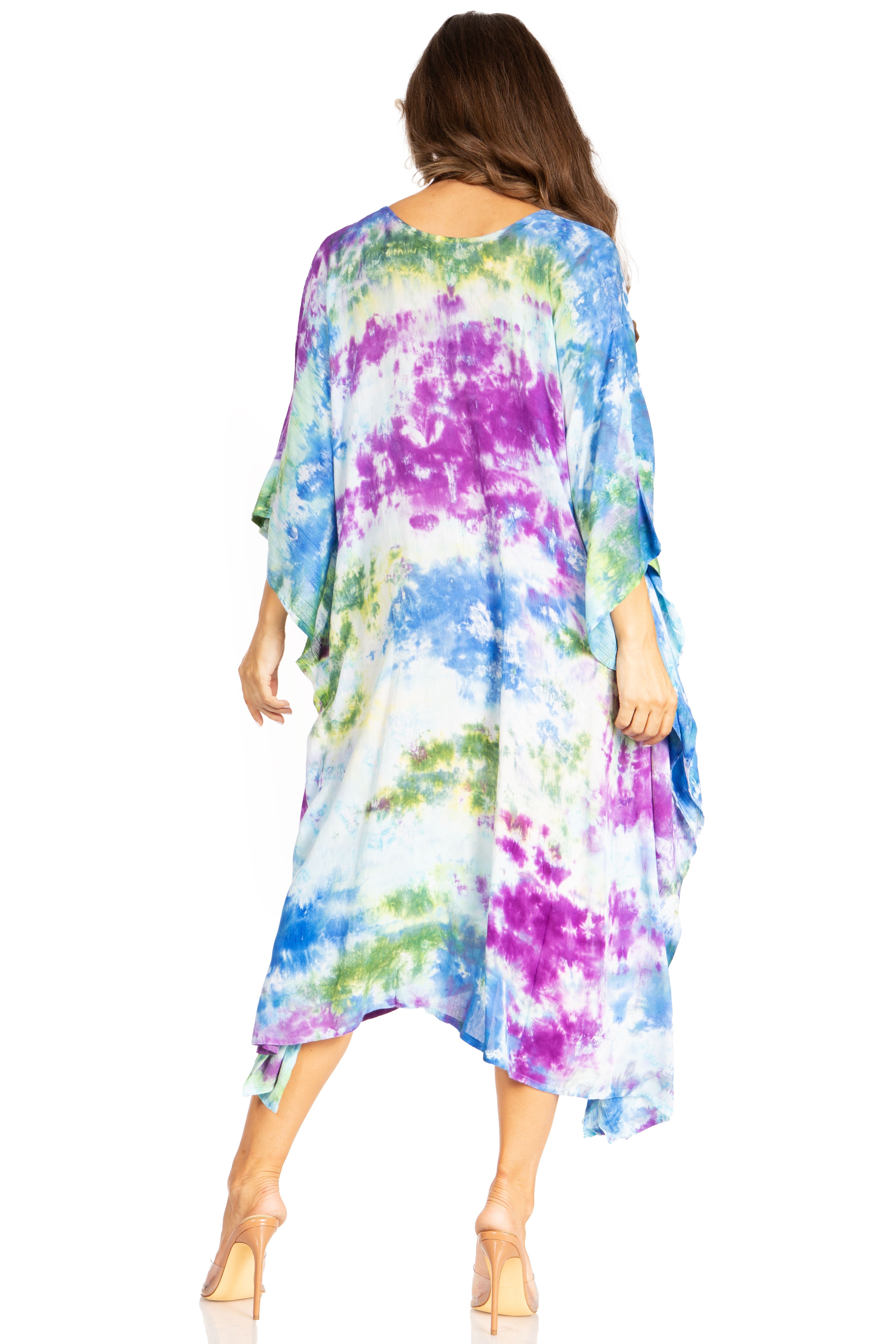 Woman wearing a colorful tie-dye dress on a white background