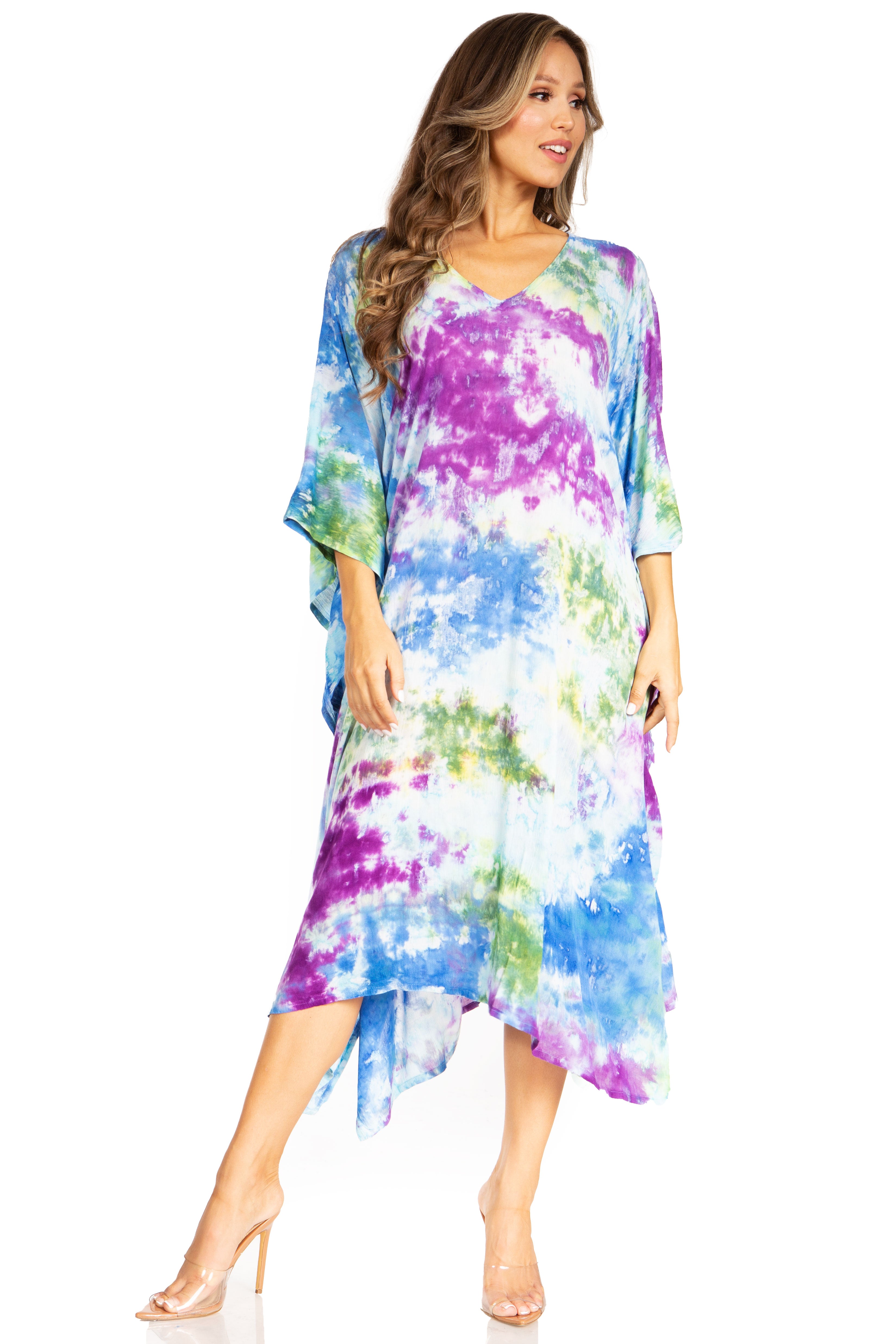 Woman wearing a colorful tie-dye dress on a white background