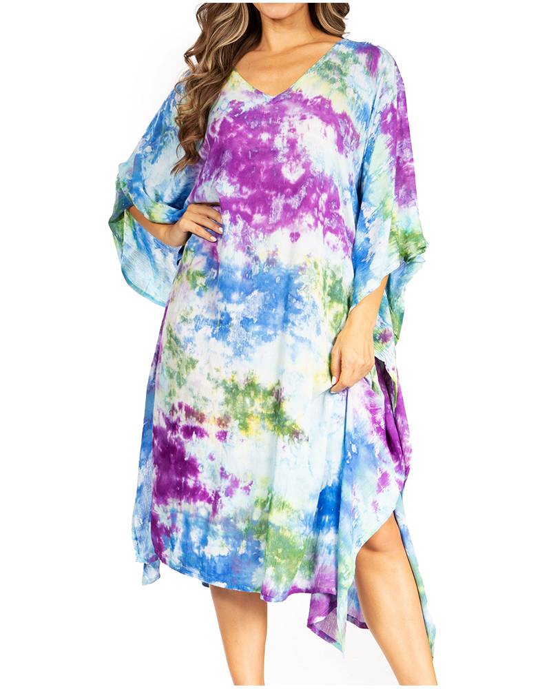 Multicolored tie-dye dress worn by a model on a white background
