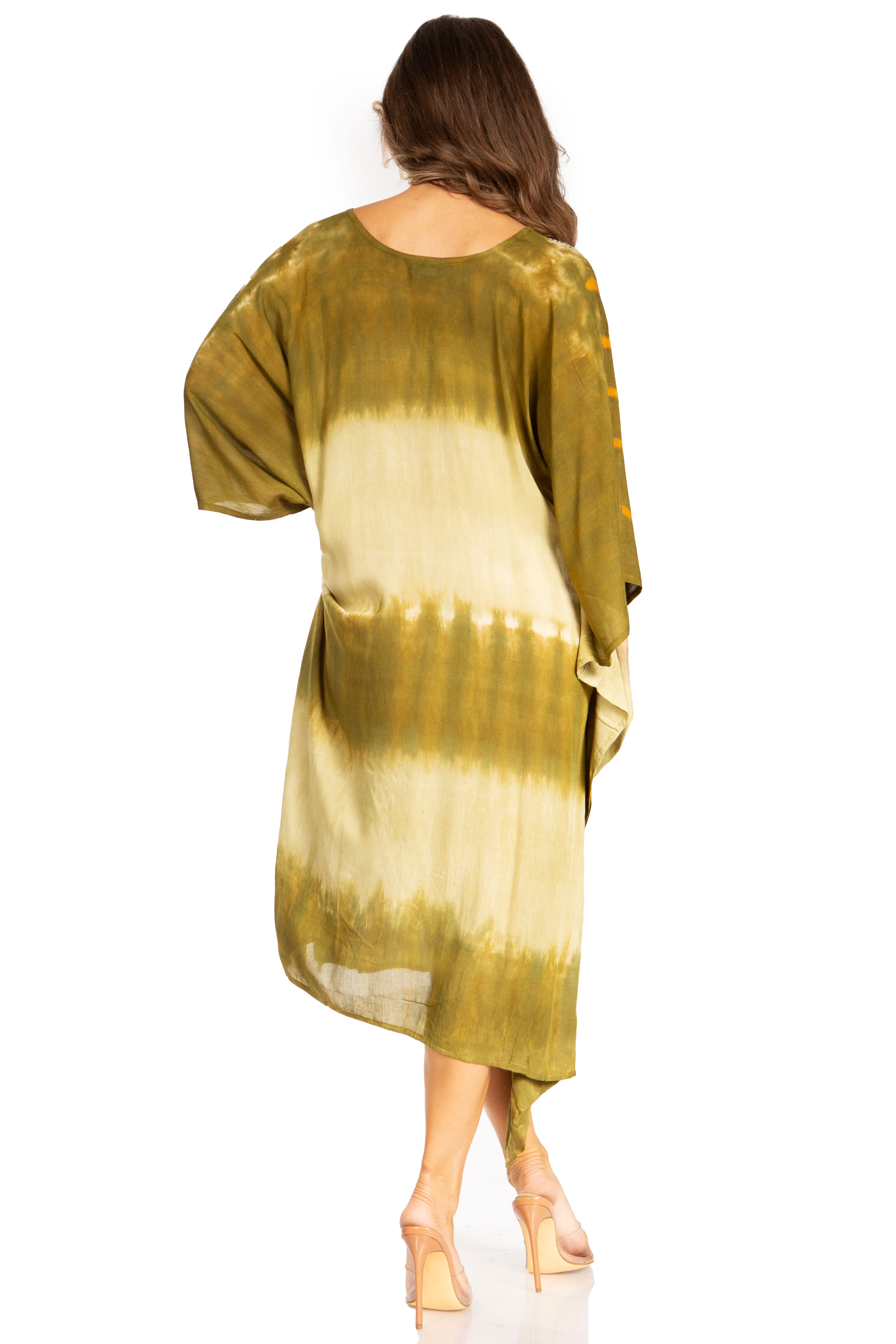 Woman wearing a green and beige tie-dye dress on a white background