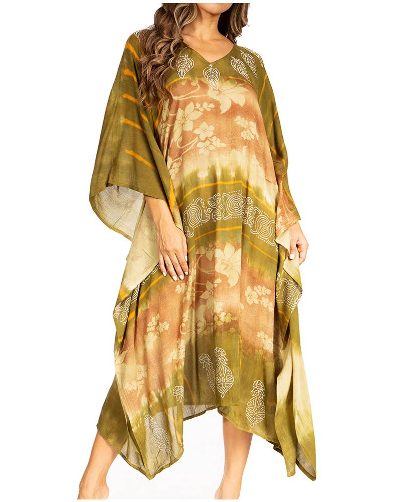 Woman wearing a floral dress with a green shawl over it on a white background