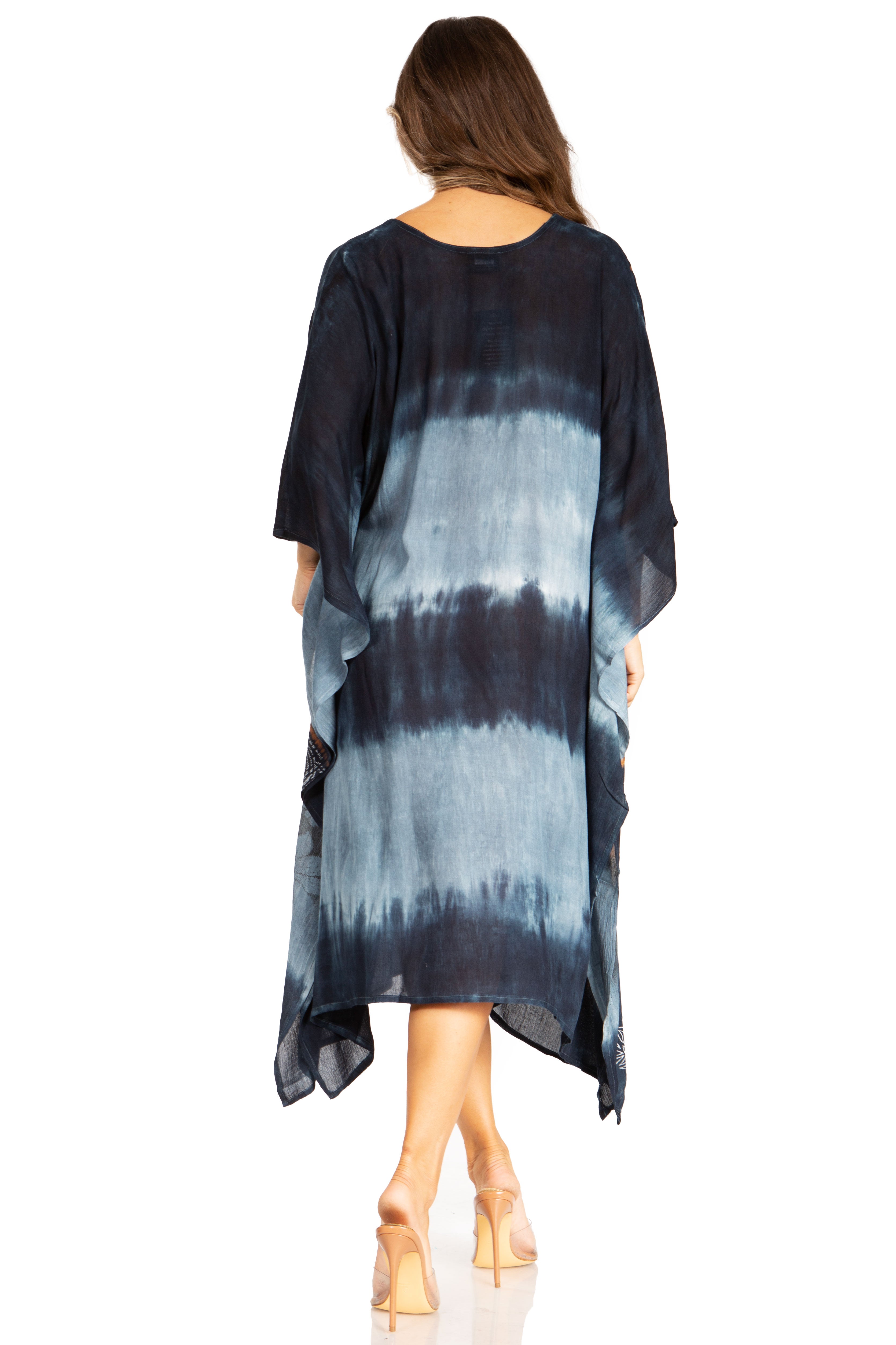Woman wearing a black and blue tie-dye dress on a white background