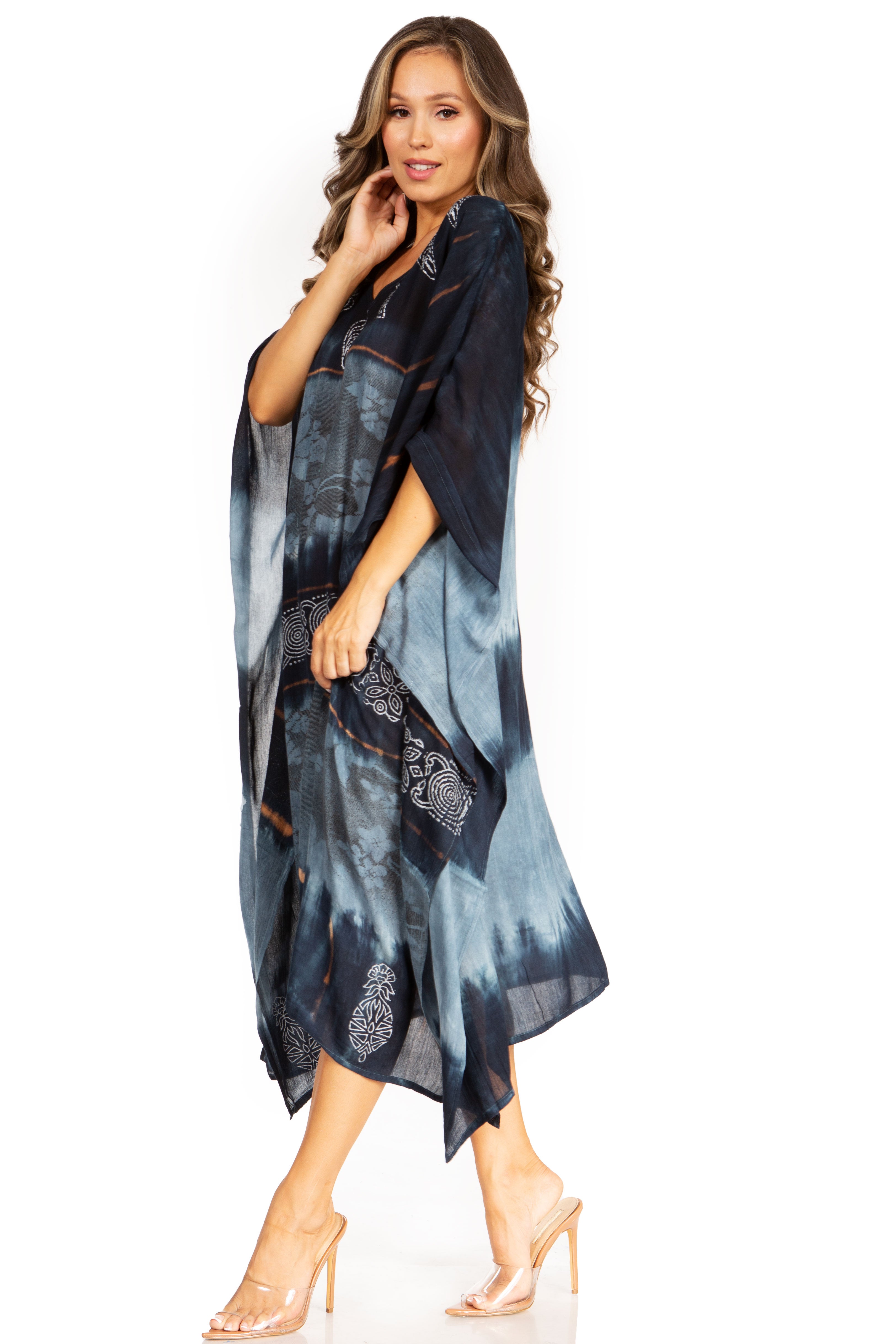 Woman wearing a blue and black patterned dress on a white background