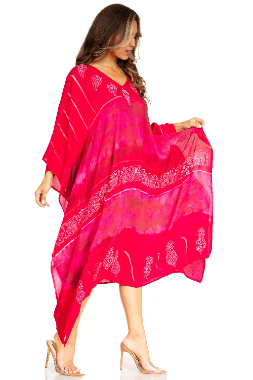 Woman wearing a bright pink scarf with white patterns on a white background