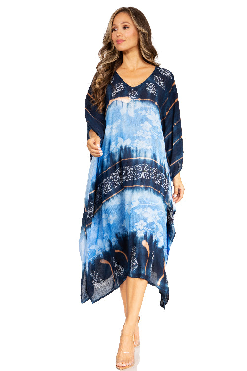 Woman wearing a blue and navy patterned dress on a white background