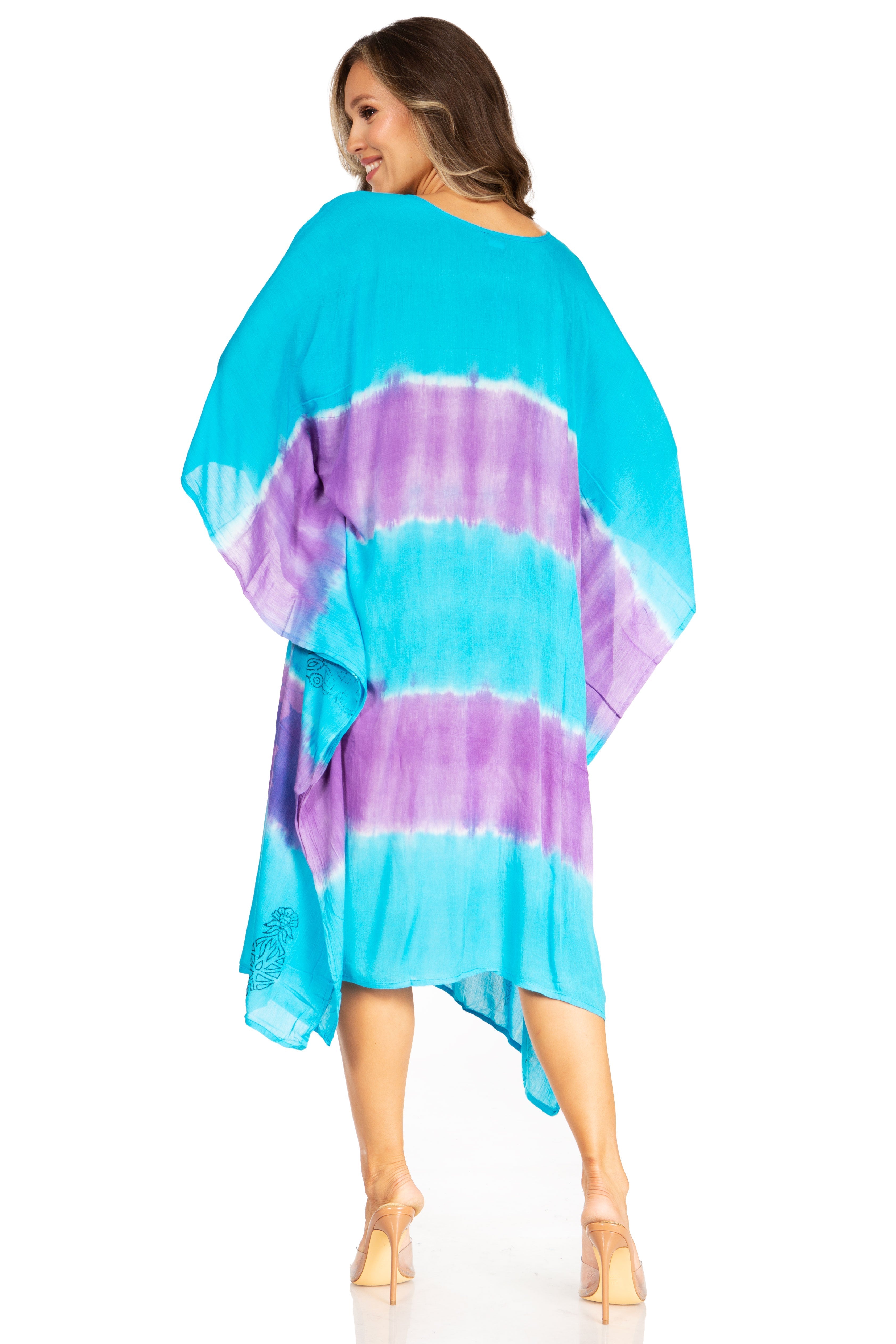 Woman wearing a tie-dye blue and purple dress on a white background