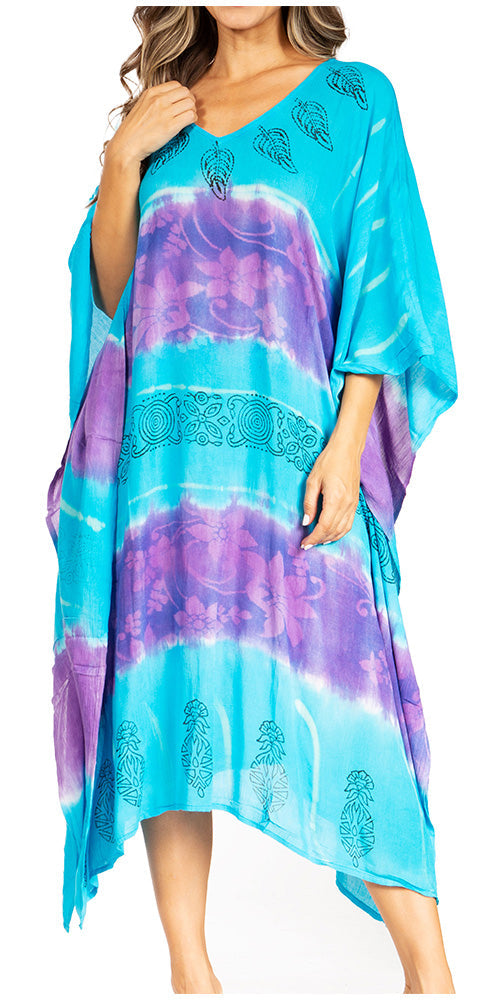 Woman wearing a colorful tie-dye dress with a white background