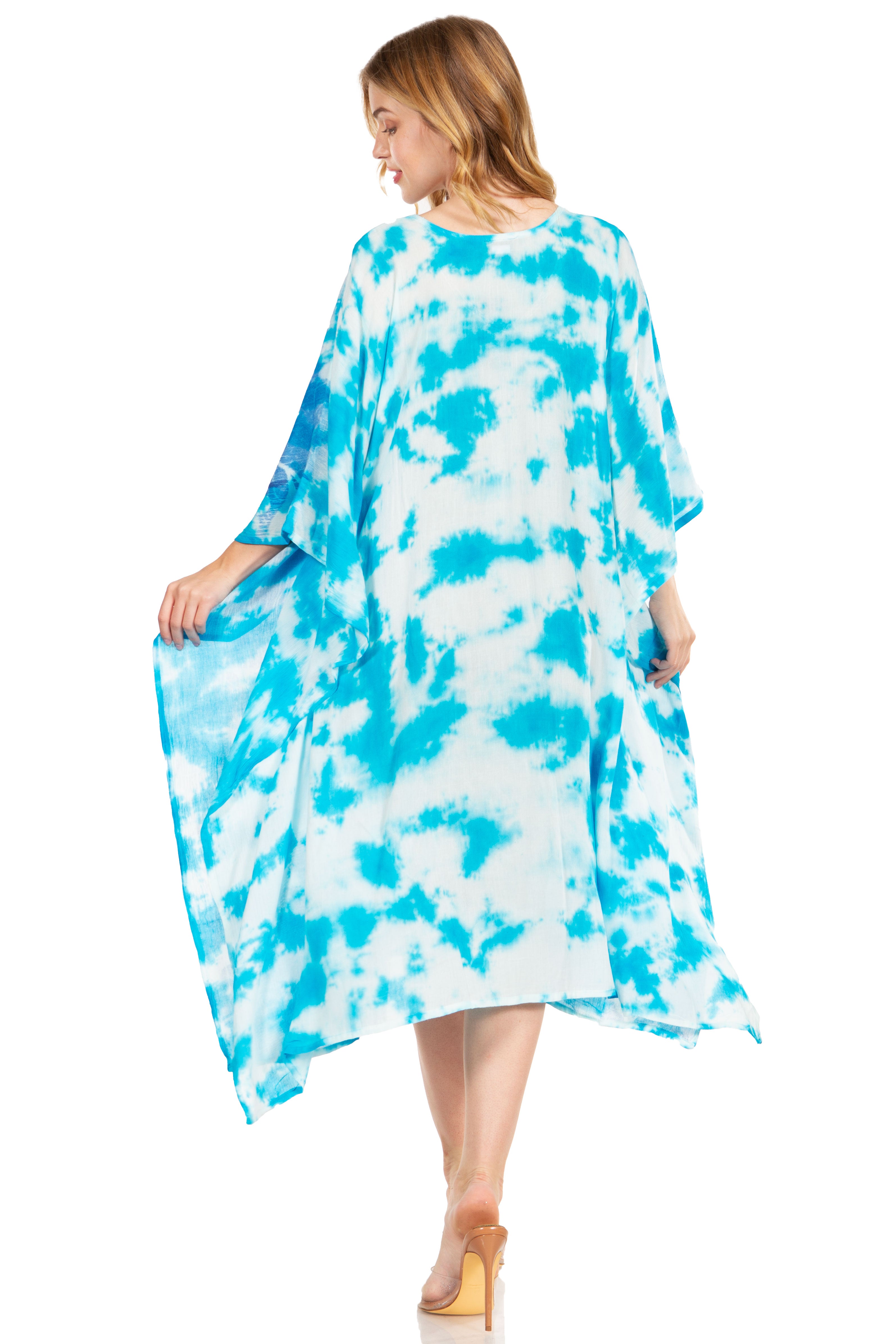 Woman wearing a blue and white tie-dye dress on a white background