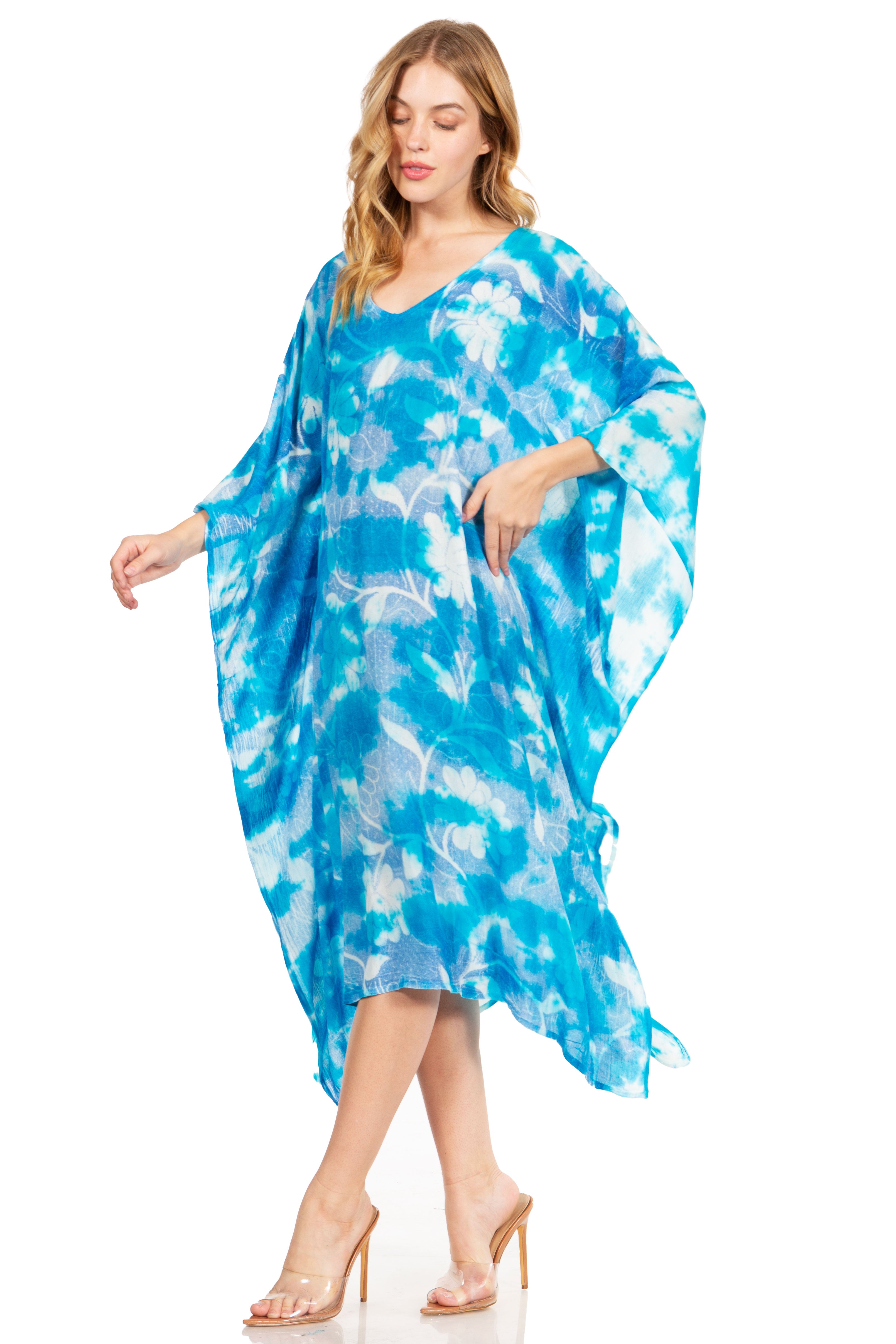 Woman wearing a blue and white patterned dress on a white background