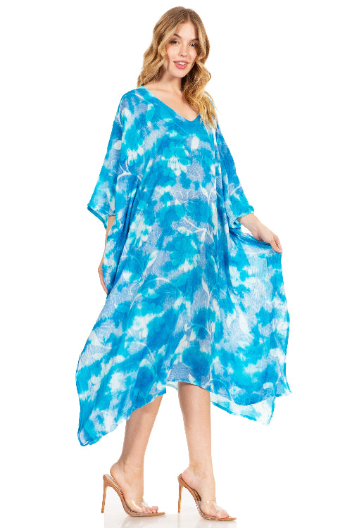 Woman wearing a blue tie-dye dress on a white background