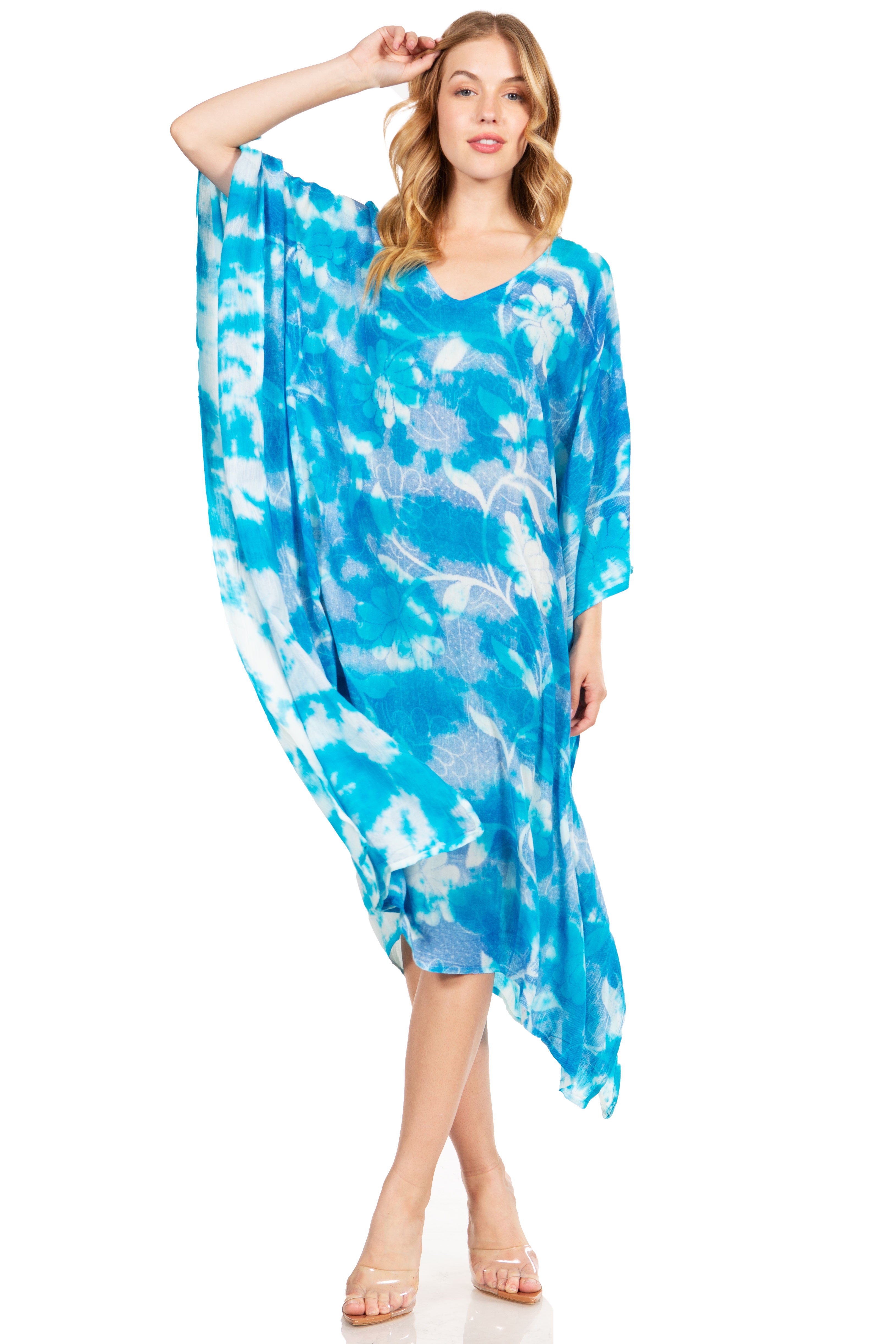Woman wearing a blue tie-dye dress on a white background