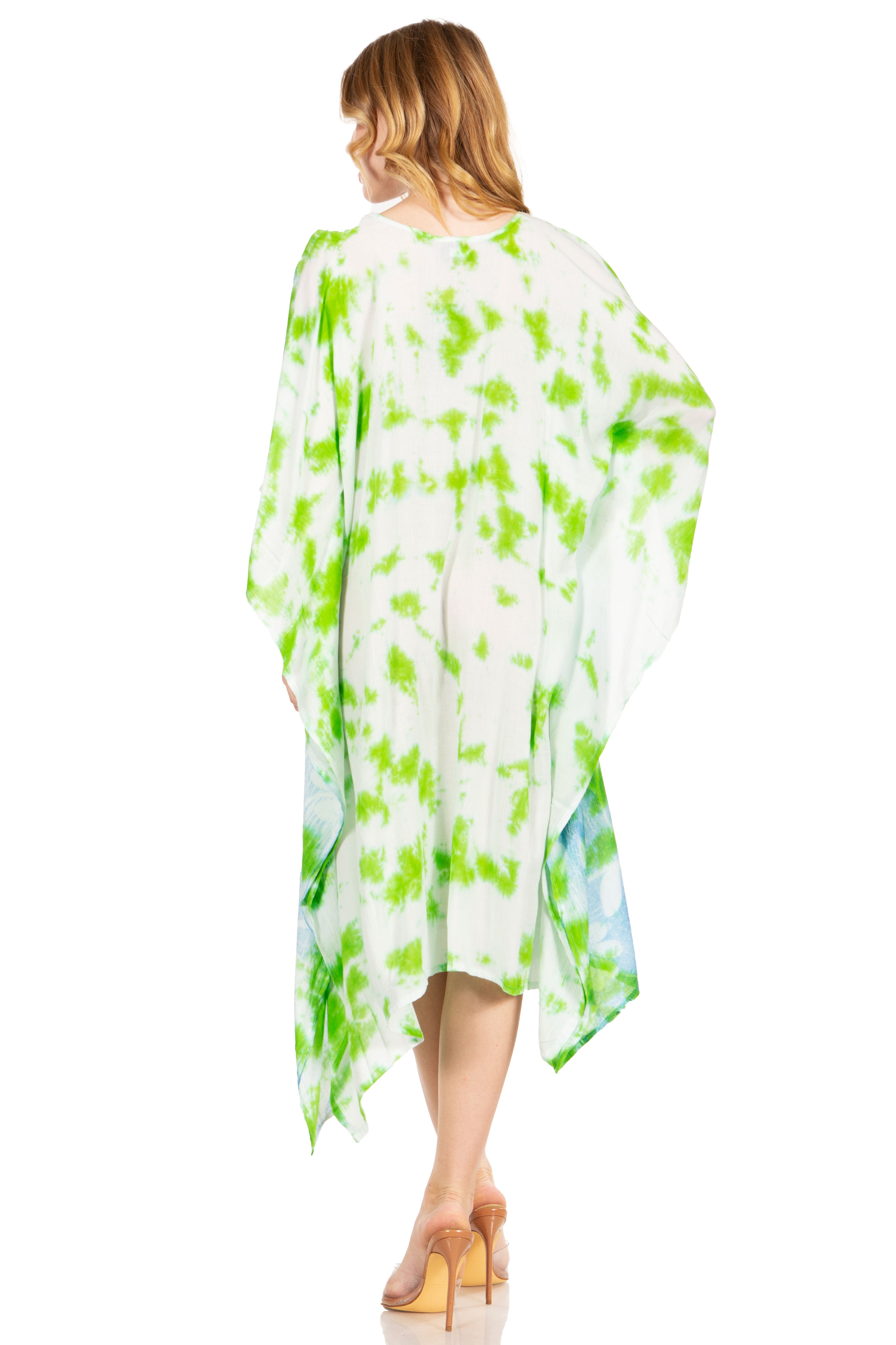 Woman wearing a green and white patterned dress on a white background