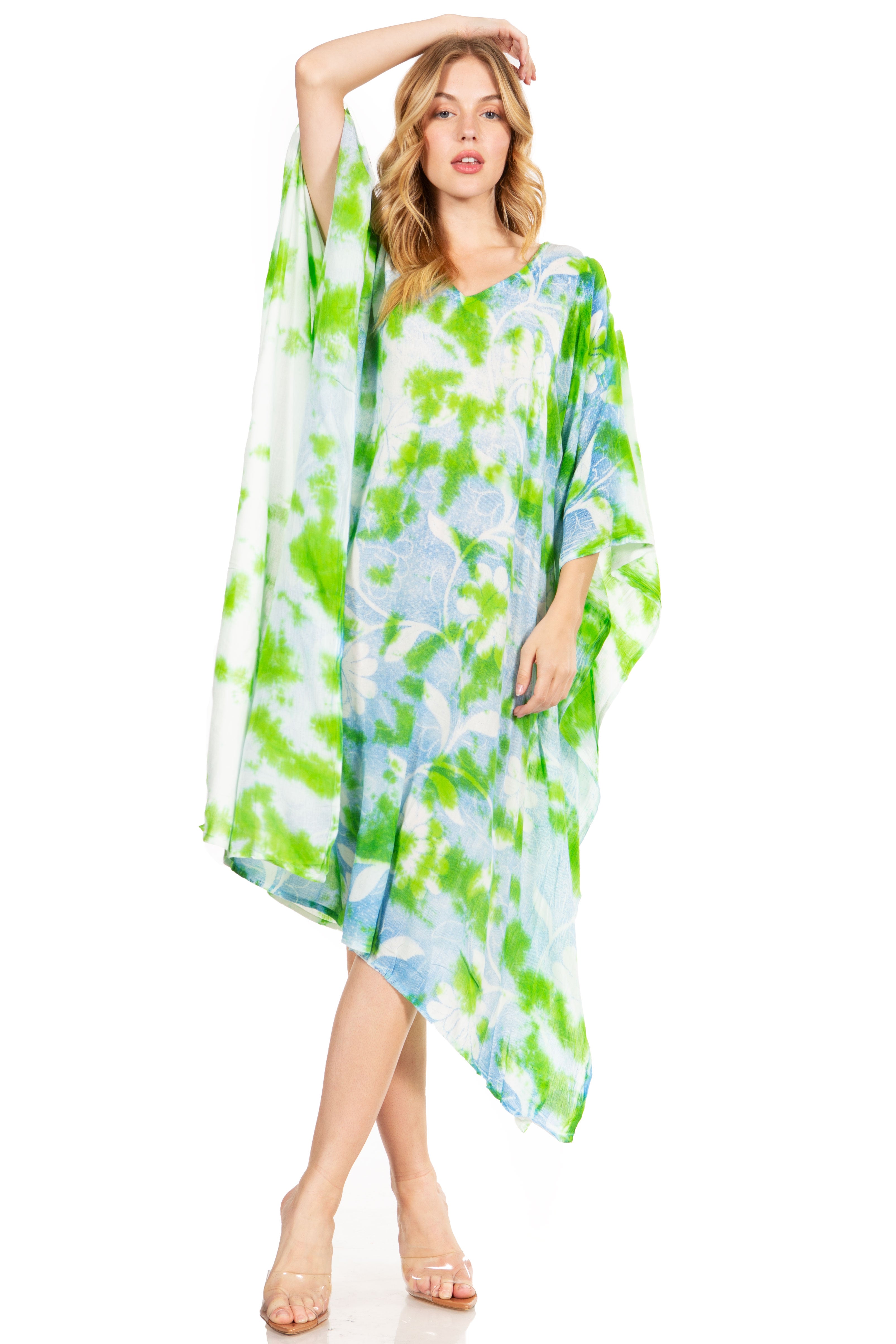 Woman wearing a green and blue patterned dress on a white background