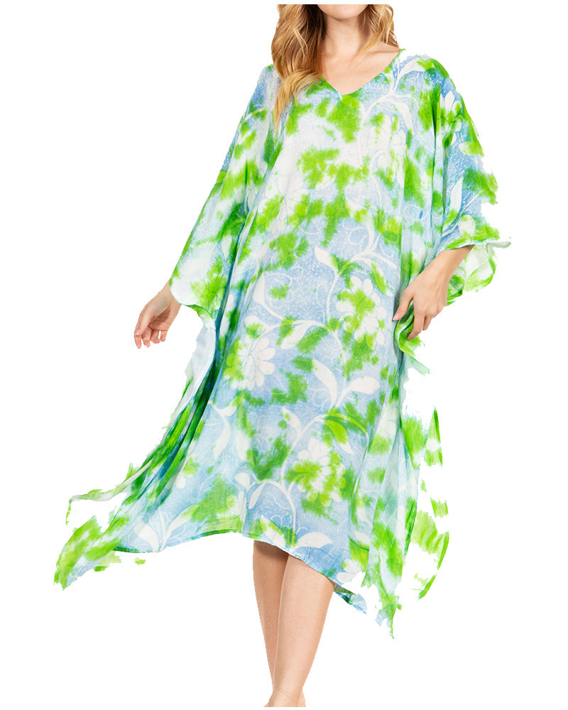 Woman wearing a floral dress with green and blue patterns on a white background