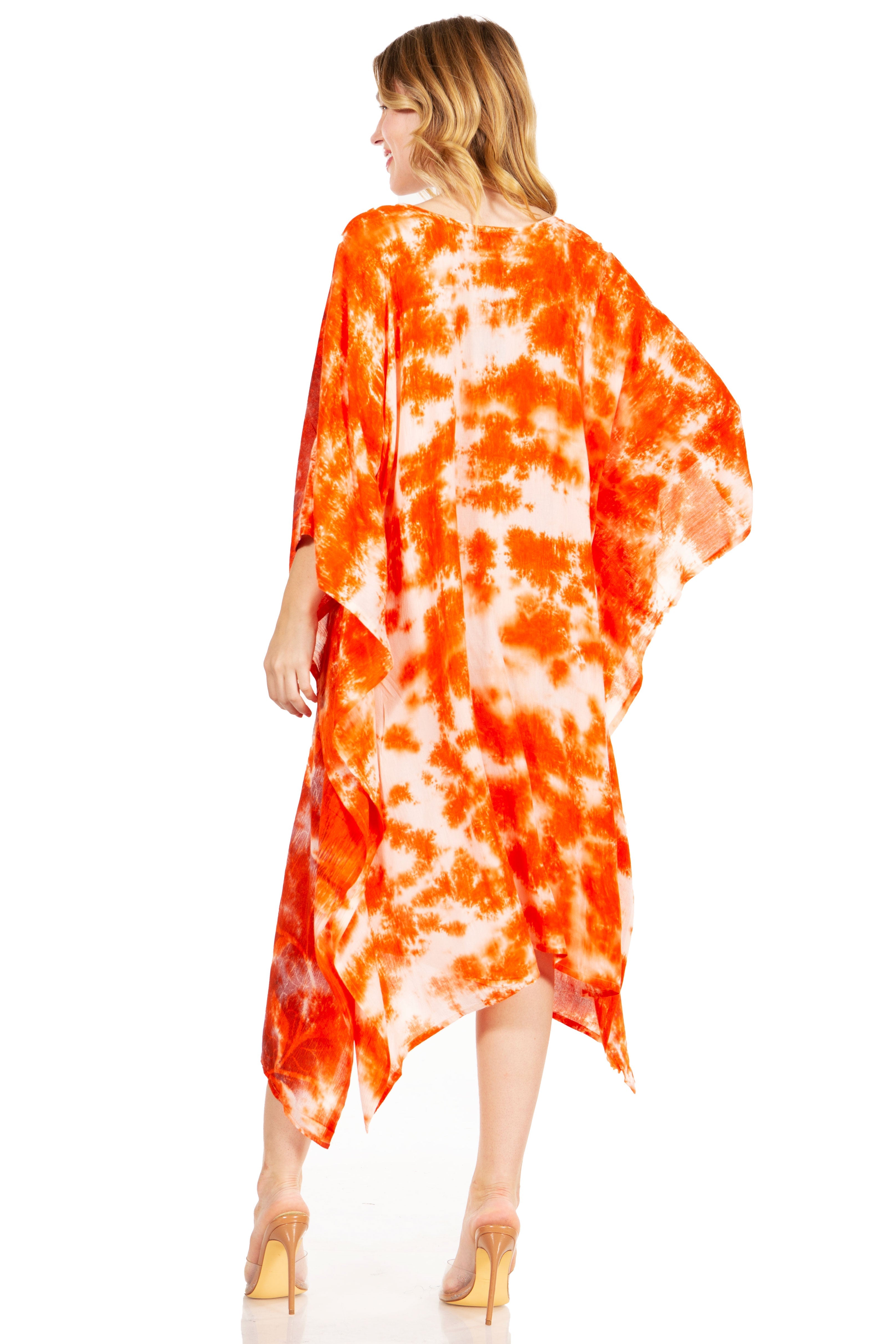 Woman wearing a vibrant orange and white tie-dye dress on a white background