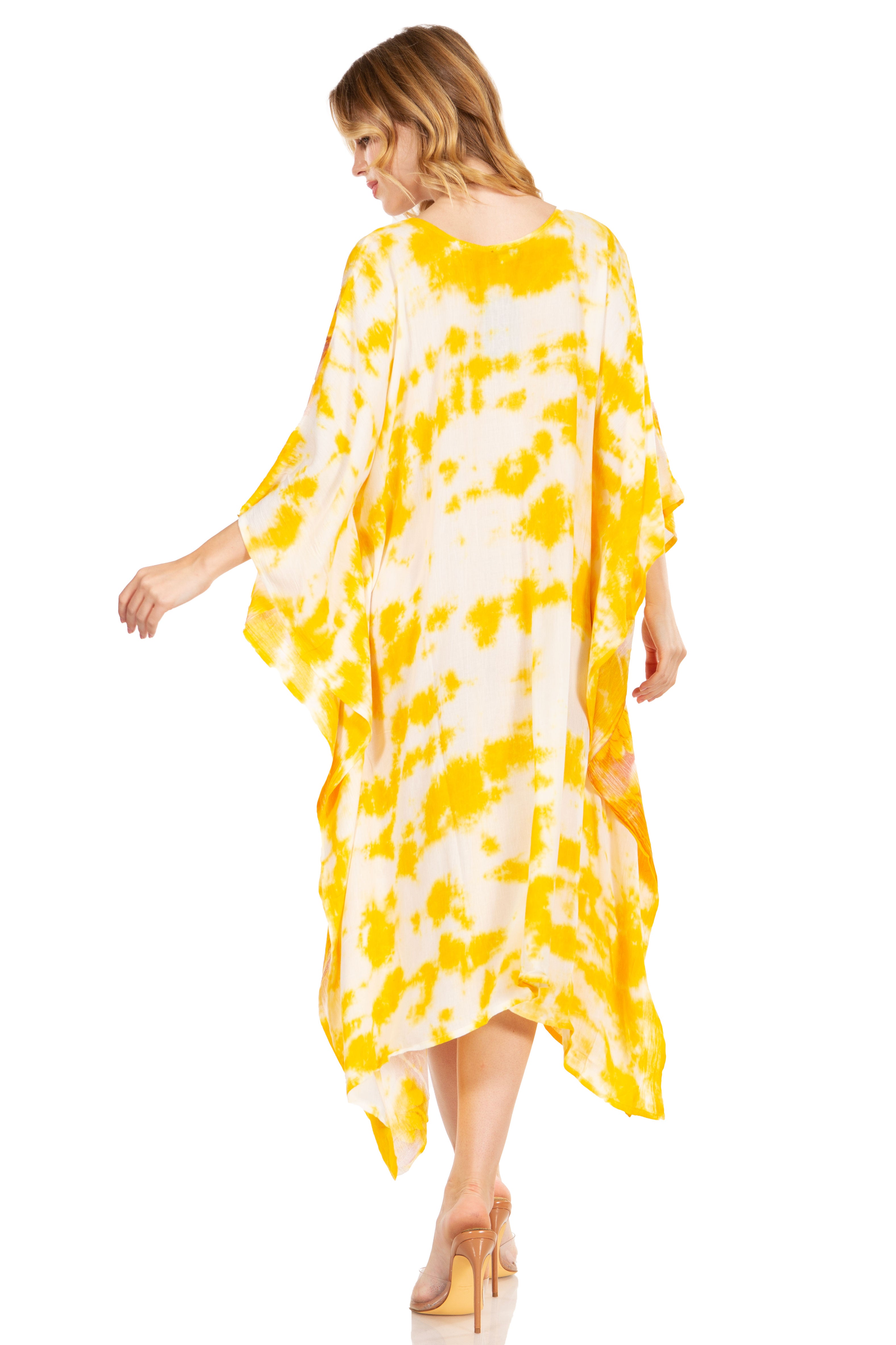 Woman wearing a yellow and white tie-dye dress on a white background