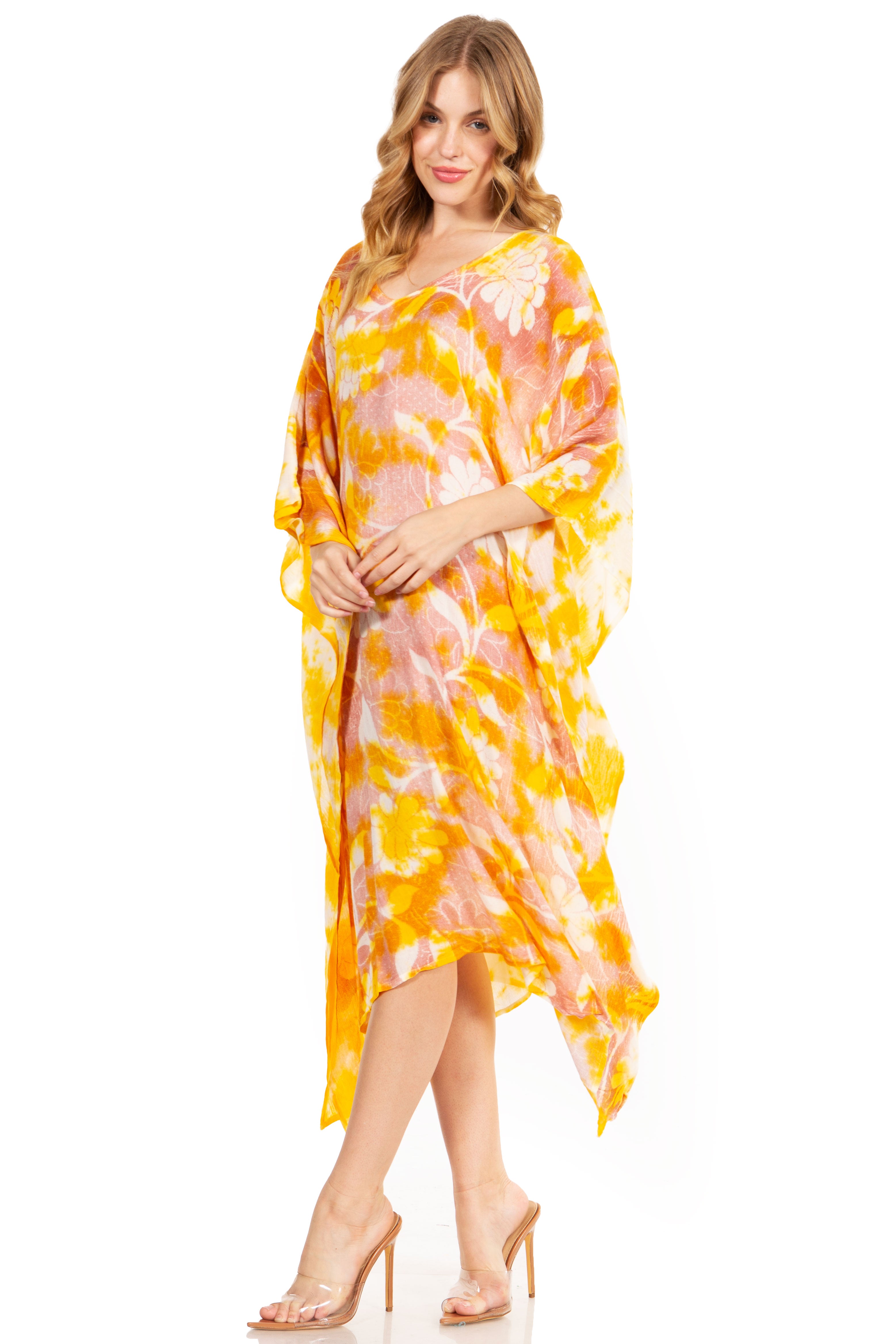 Woman wearing a yellow and pink tie-dye dress on a white background