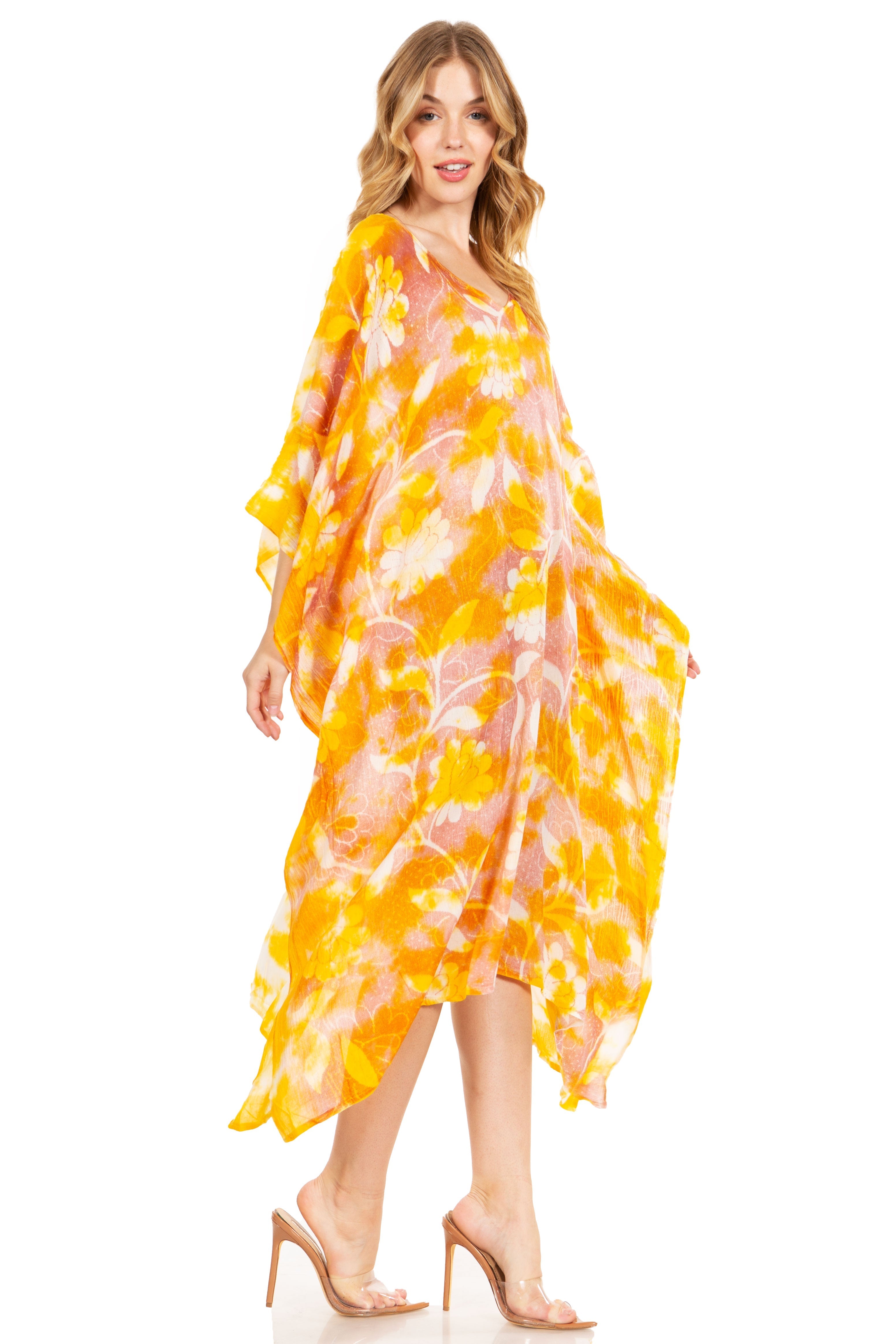 Woman wearing a yellow and pink patterned dress on a white background
