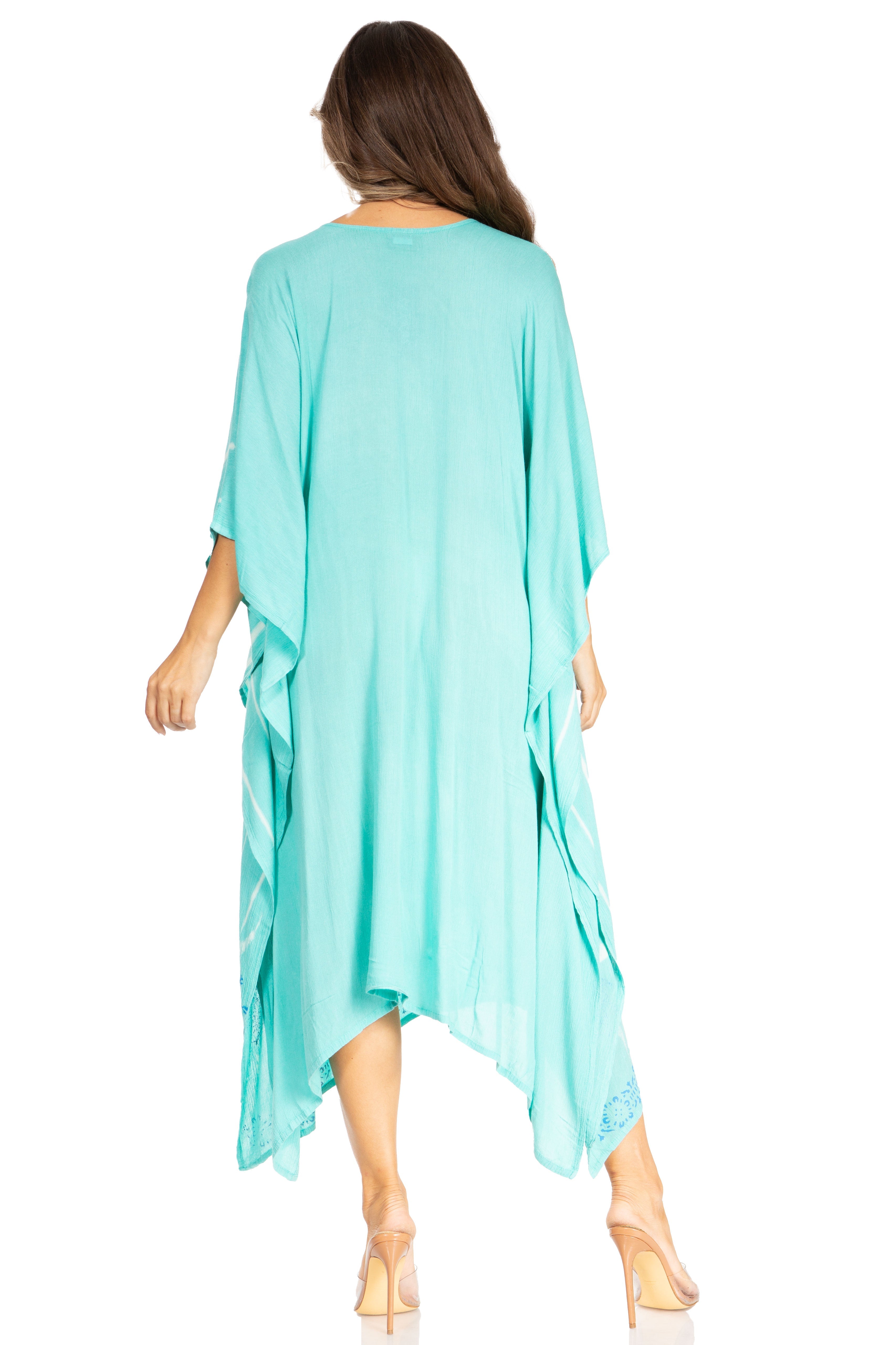 Woman wearing a light blue kimono-style garment on a white background