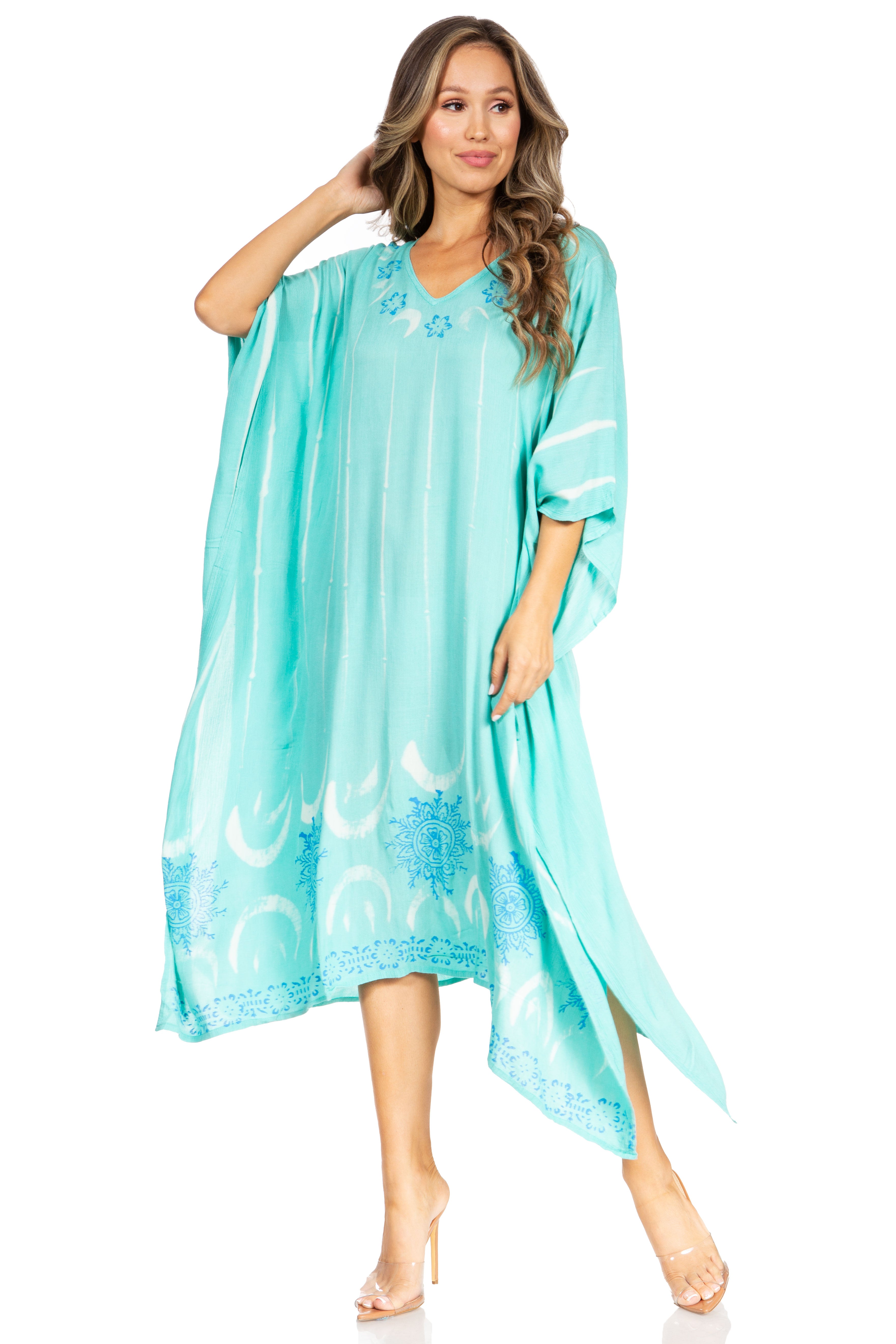 Woman wearing a light blue dress with moon patterns on a white background