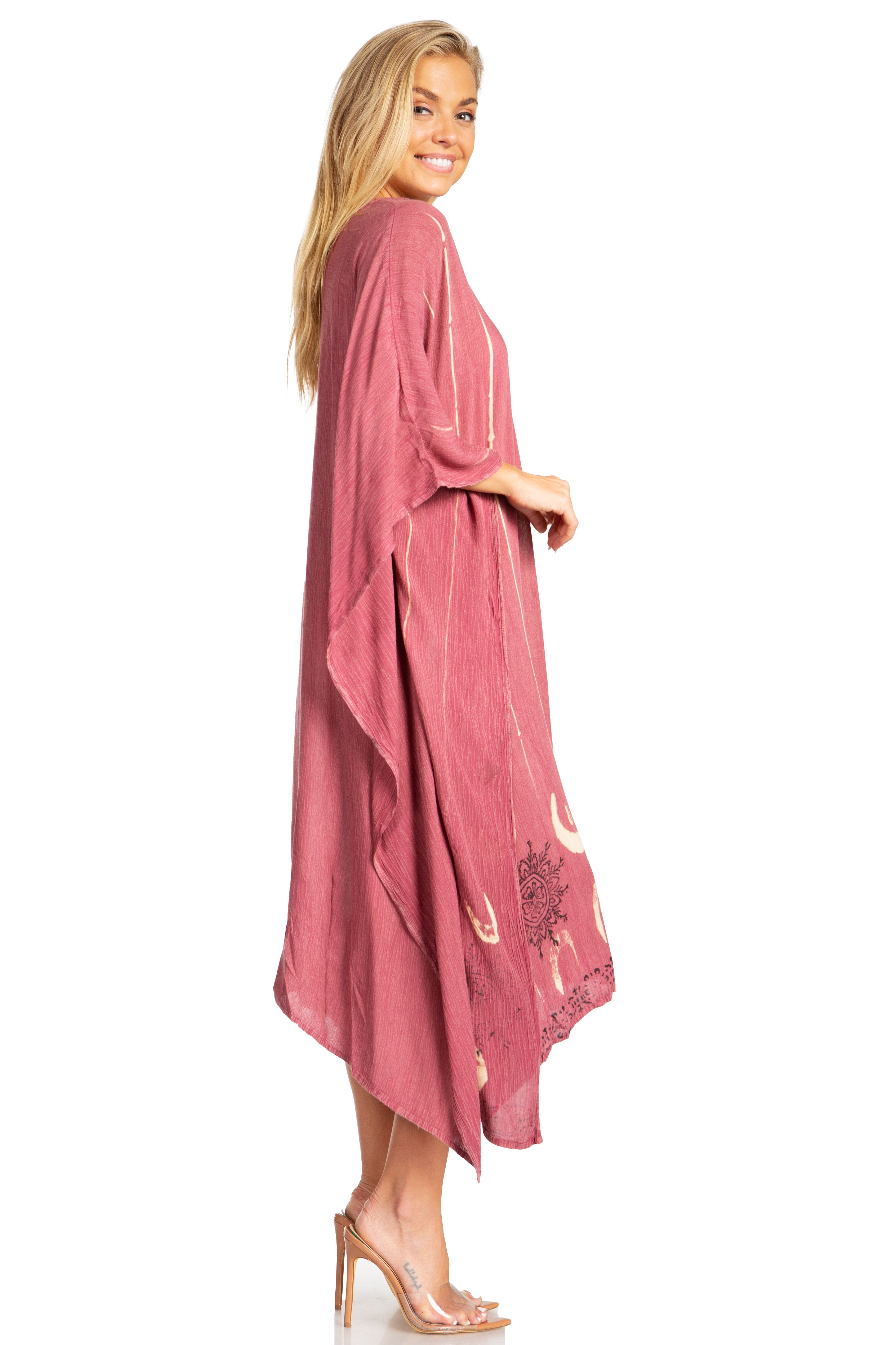 Woman wearing a pink kimono-style garment on a white background
