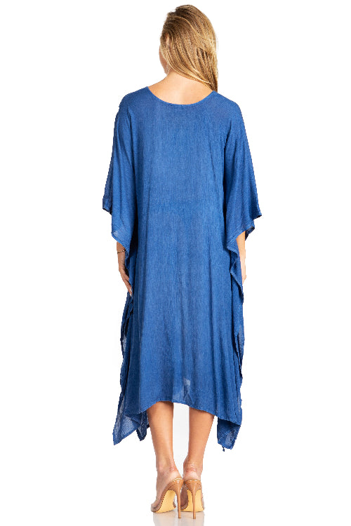 Woman wearing a blue dress with a plain white background