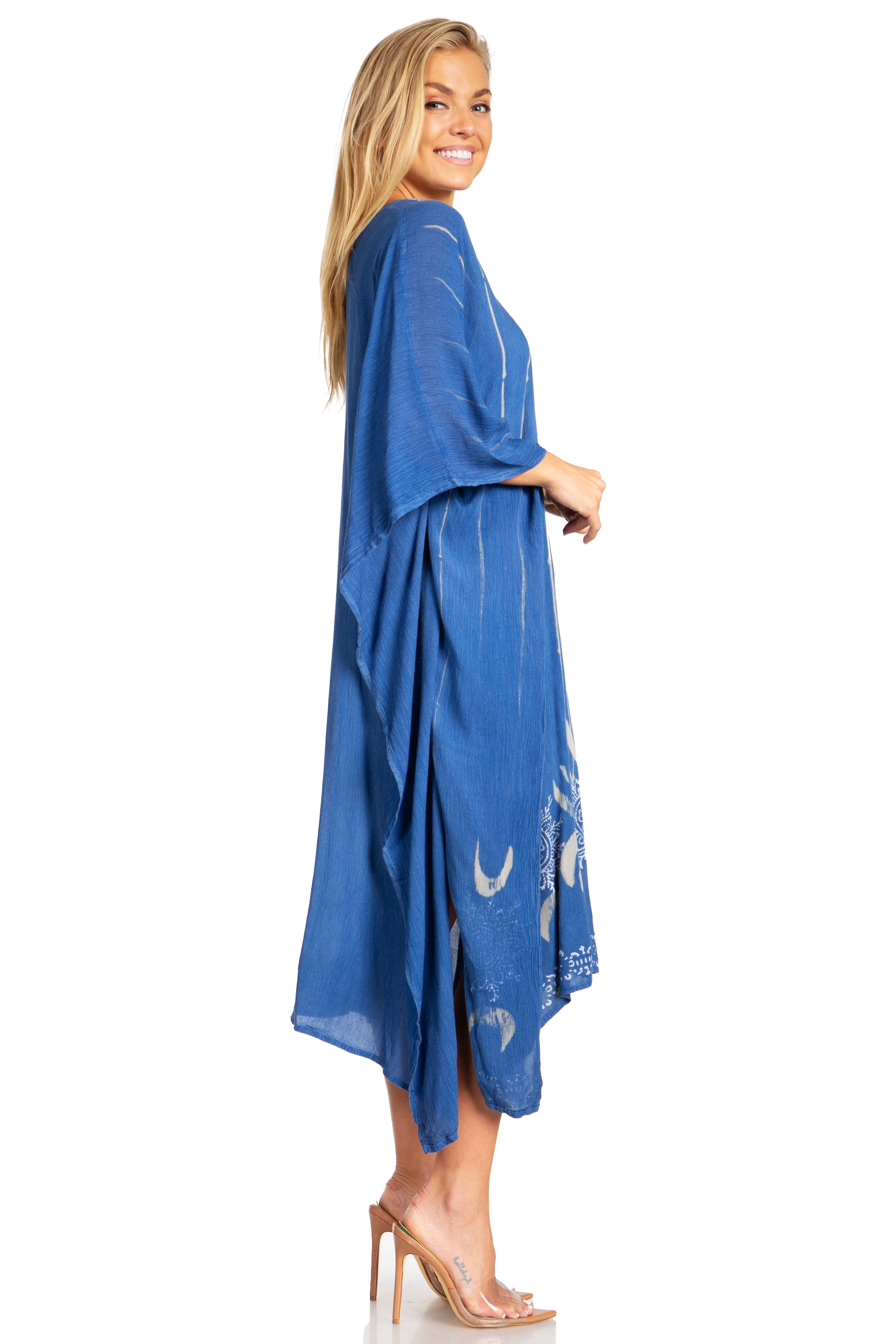 Woman wearing a blue dress with moon designs on a white background