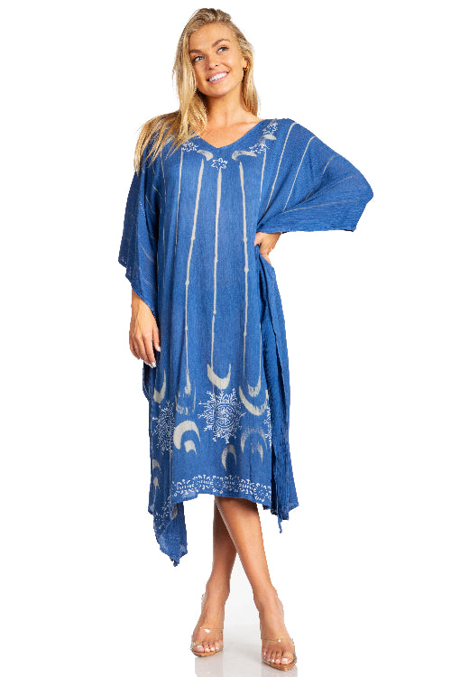 Woman wearing a blue dress with white patterns on a white background