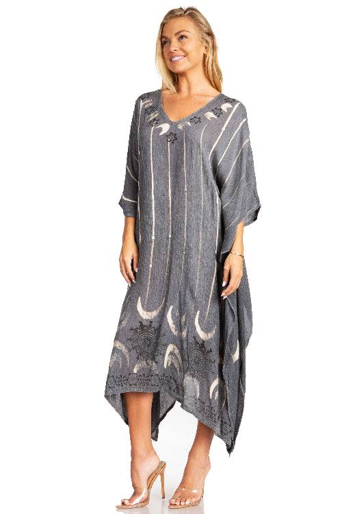 Woman wearing a gray caftan with moon pattern on a white background