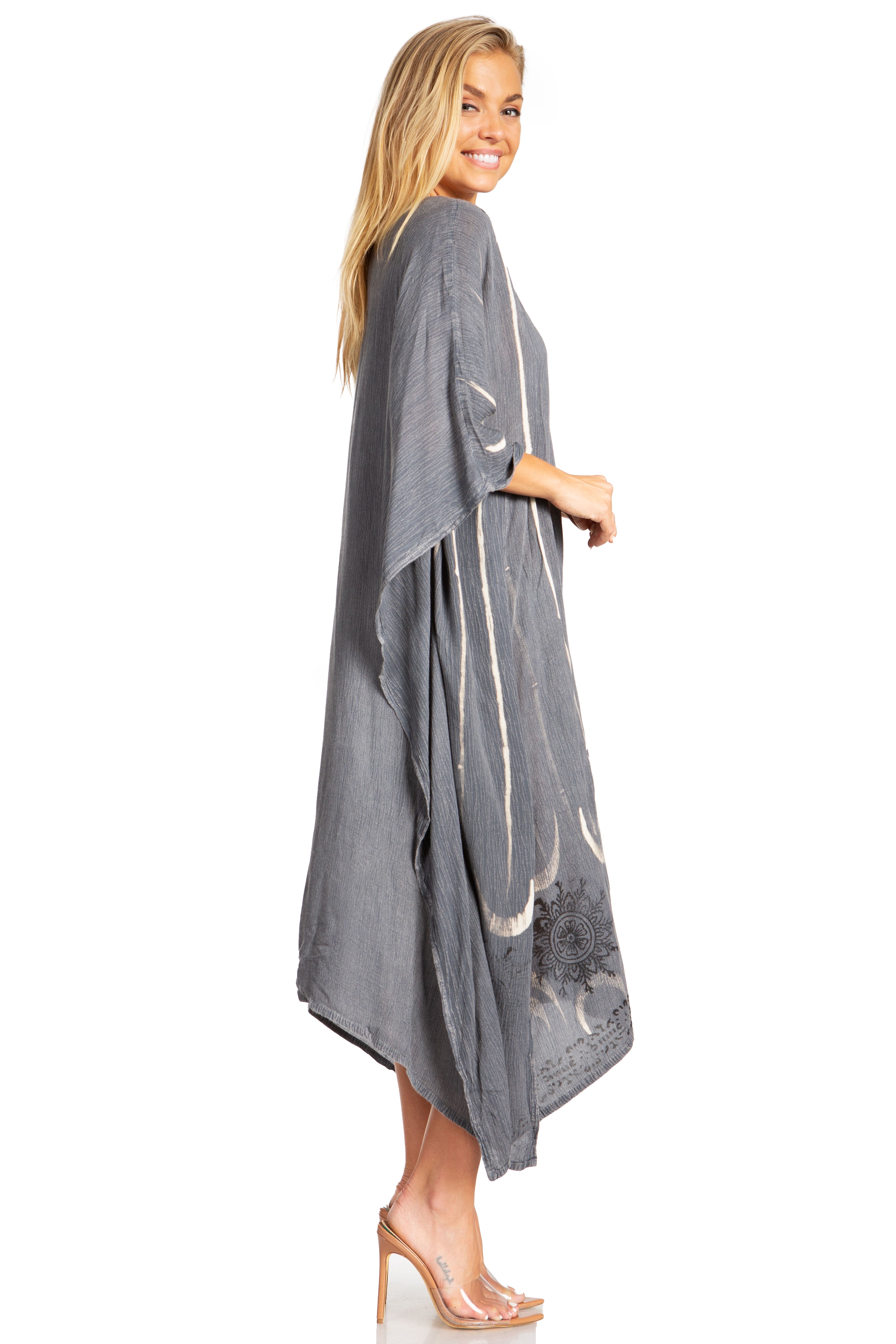 Woman wearing a gray kimono-style garment on a white background