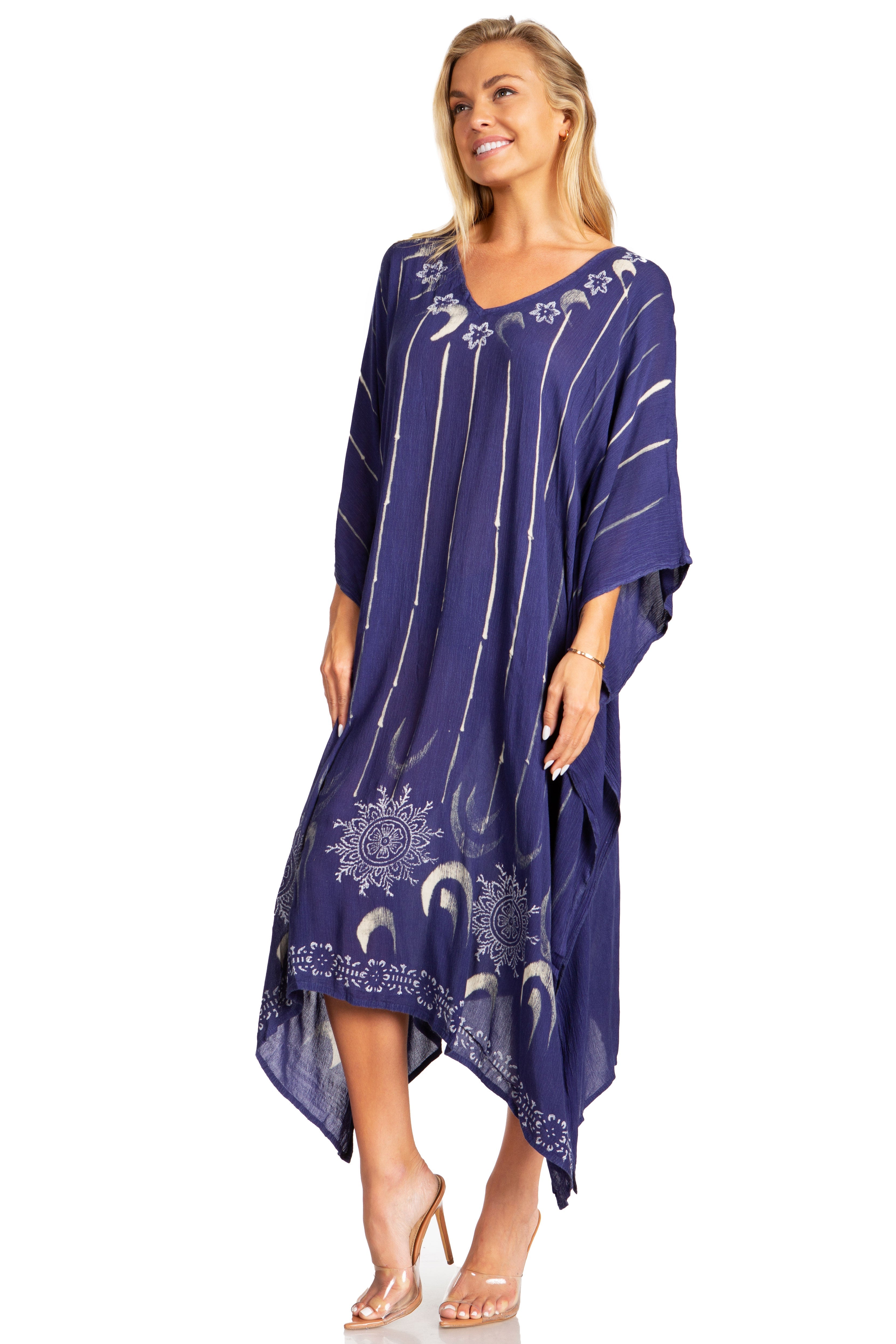 Woman wearing a purple dress with white patterns on a white background