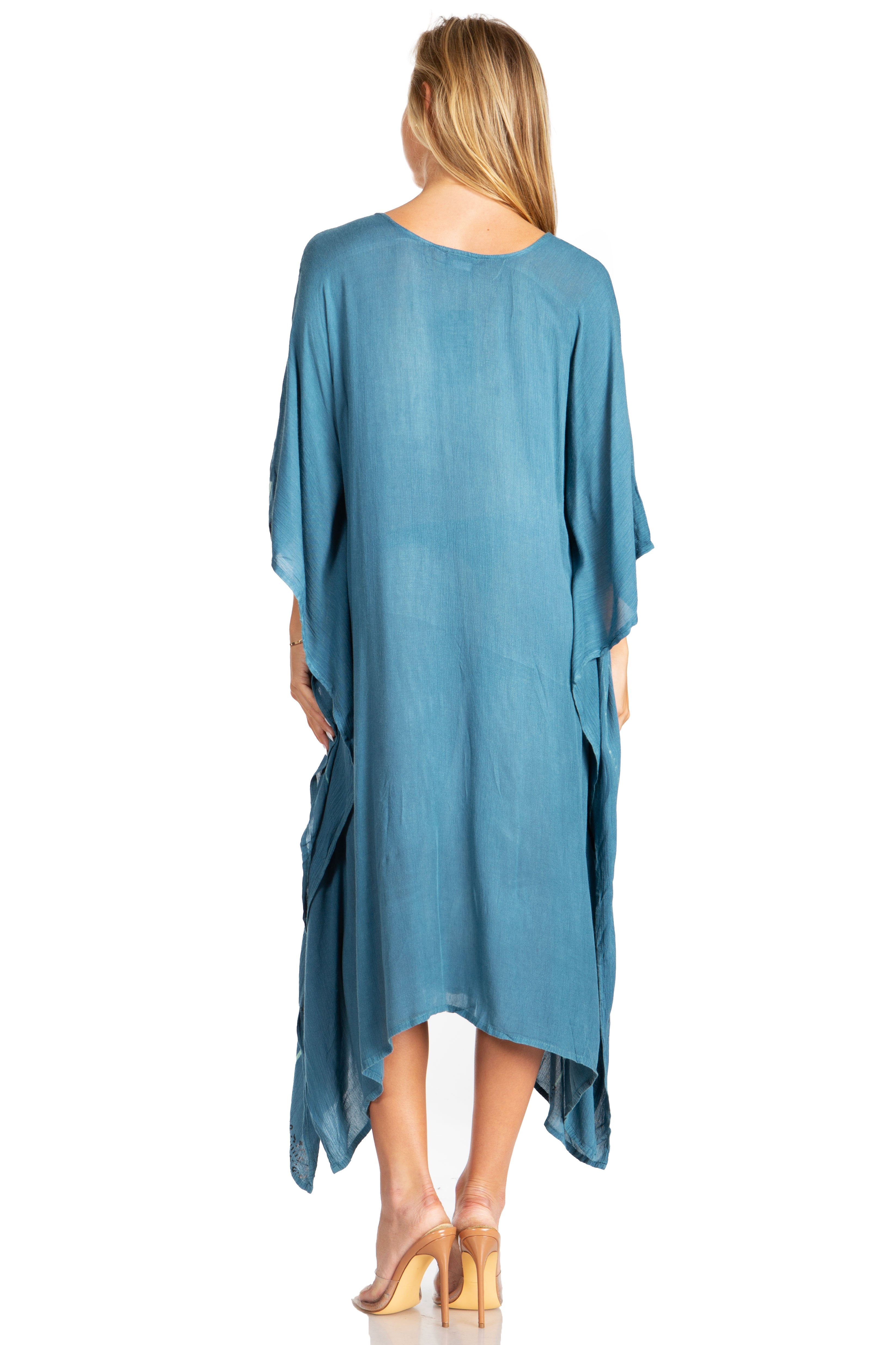 Woman wearing a blue dress with a white background