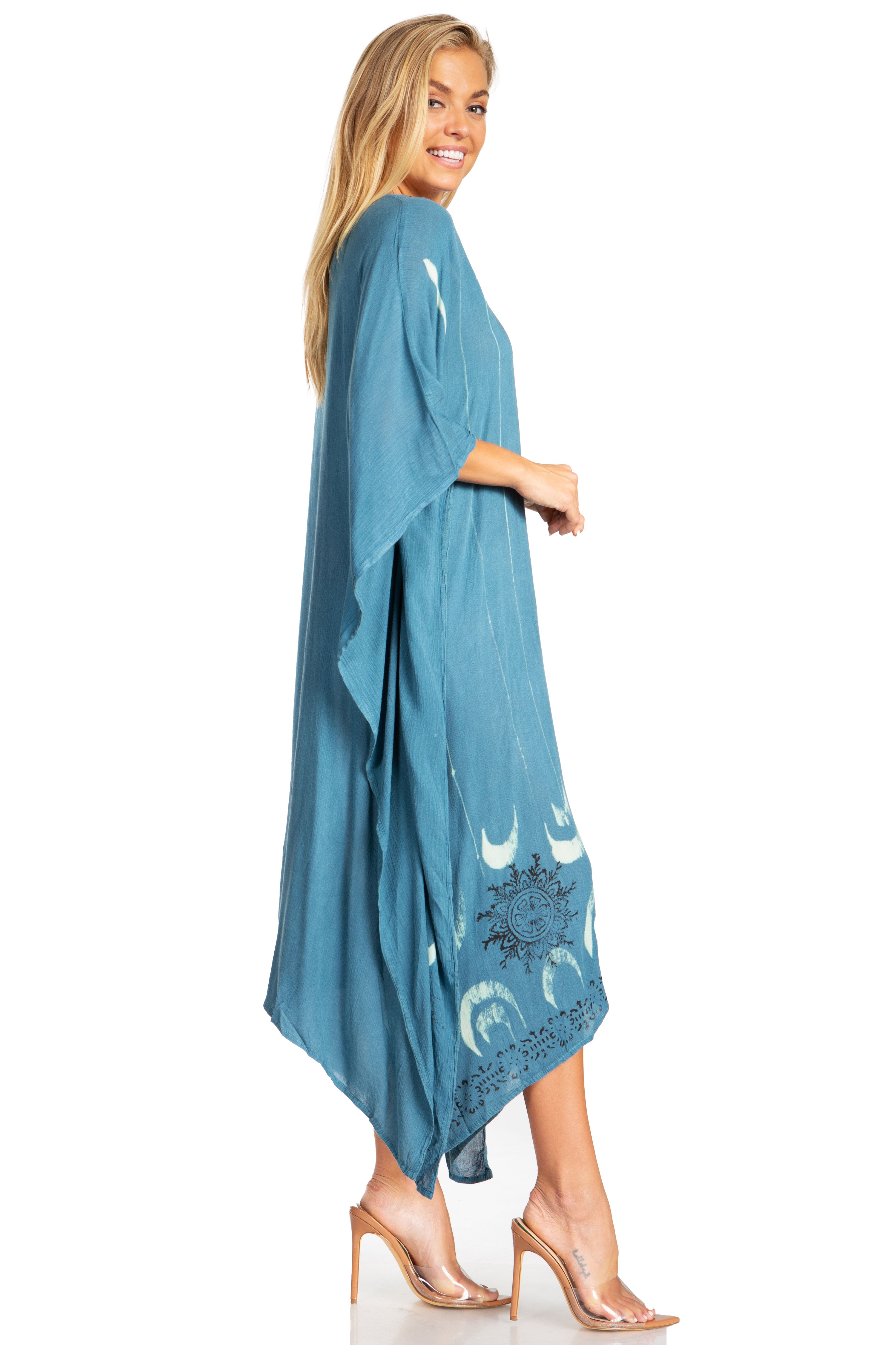 Woman wearing a blue kimono-style garment with white patterns on a white background