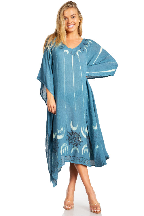 Woman wearing a blue dress with white patterns on a white background