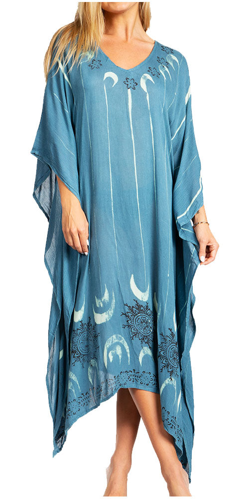 Blue caftan with white moon and star patterns worn by a model on a white background
