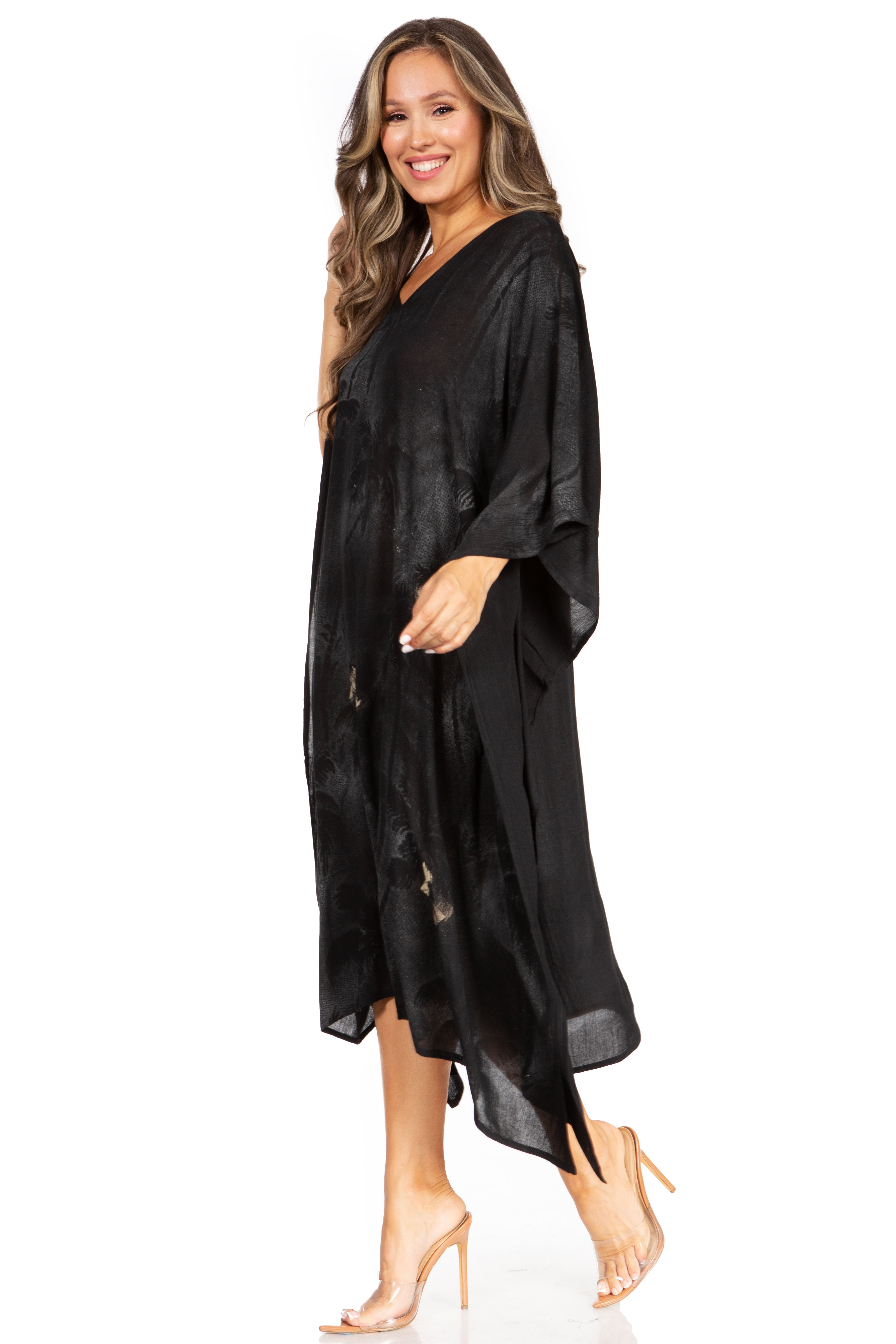 Woman wearing a black kimono-style garment on a white background