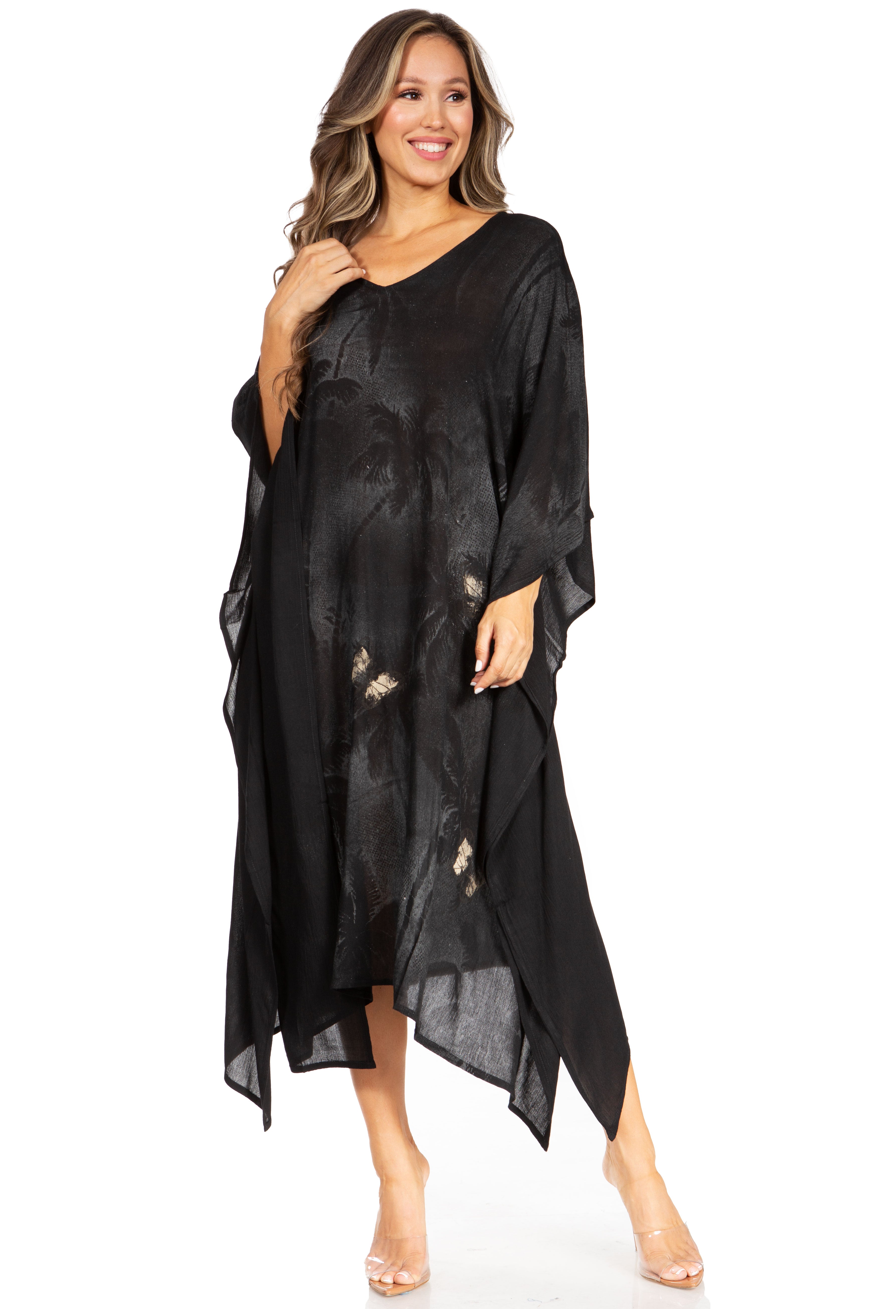 Woman wearing a black dress with floral details on a white background