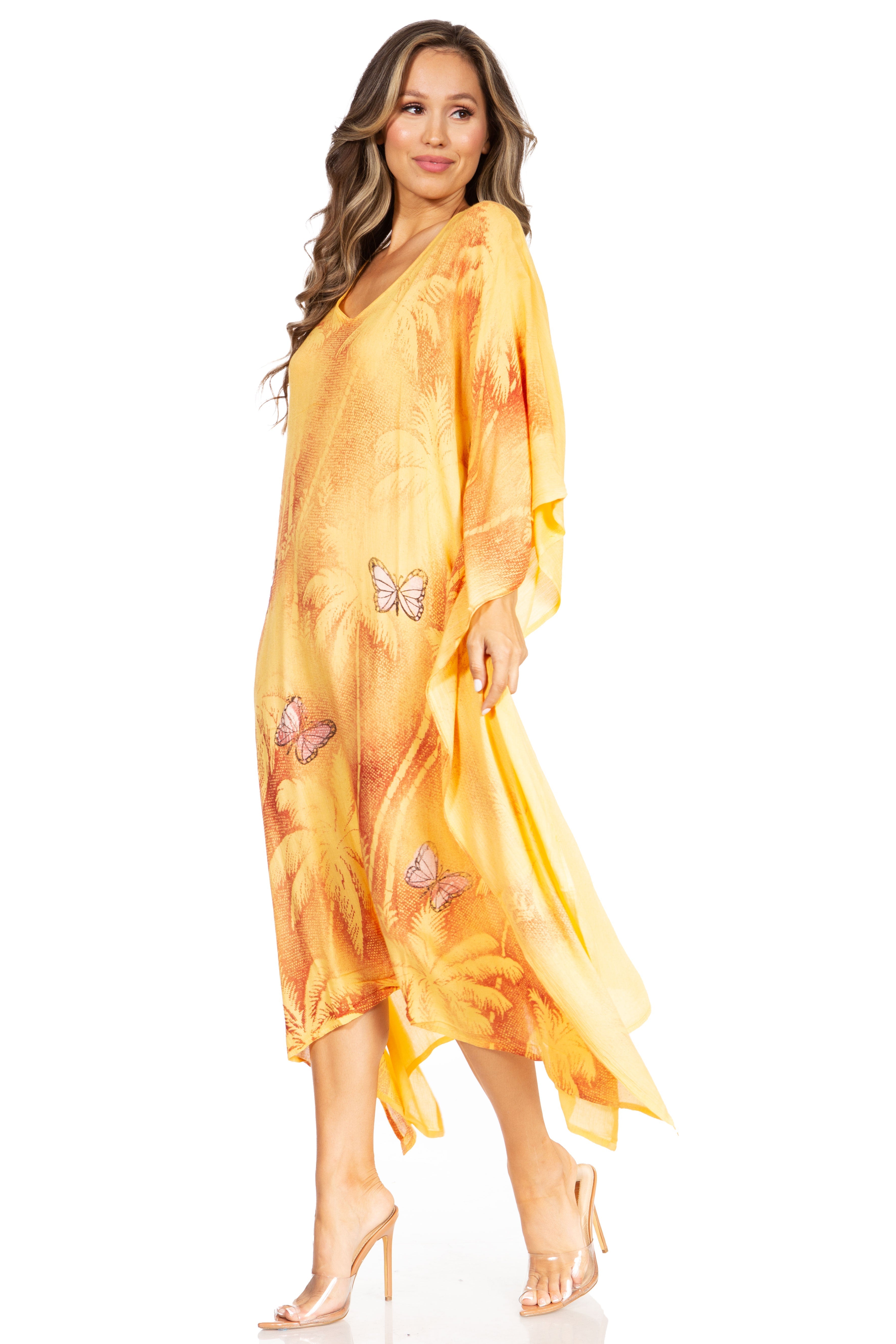 Woman wearing a yellow butterfly-patterned dress on a white background