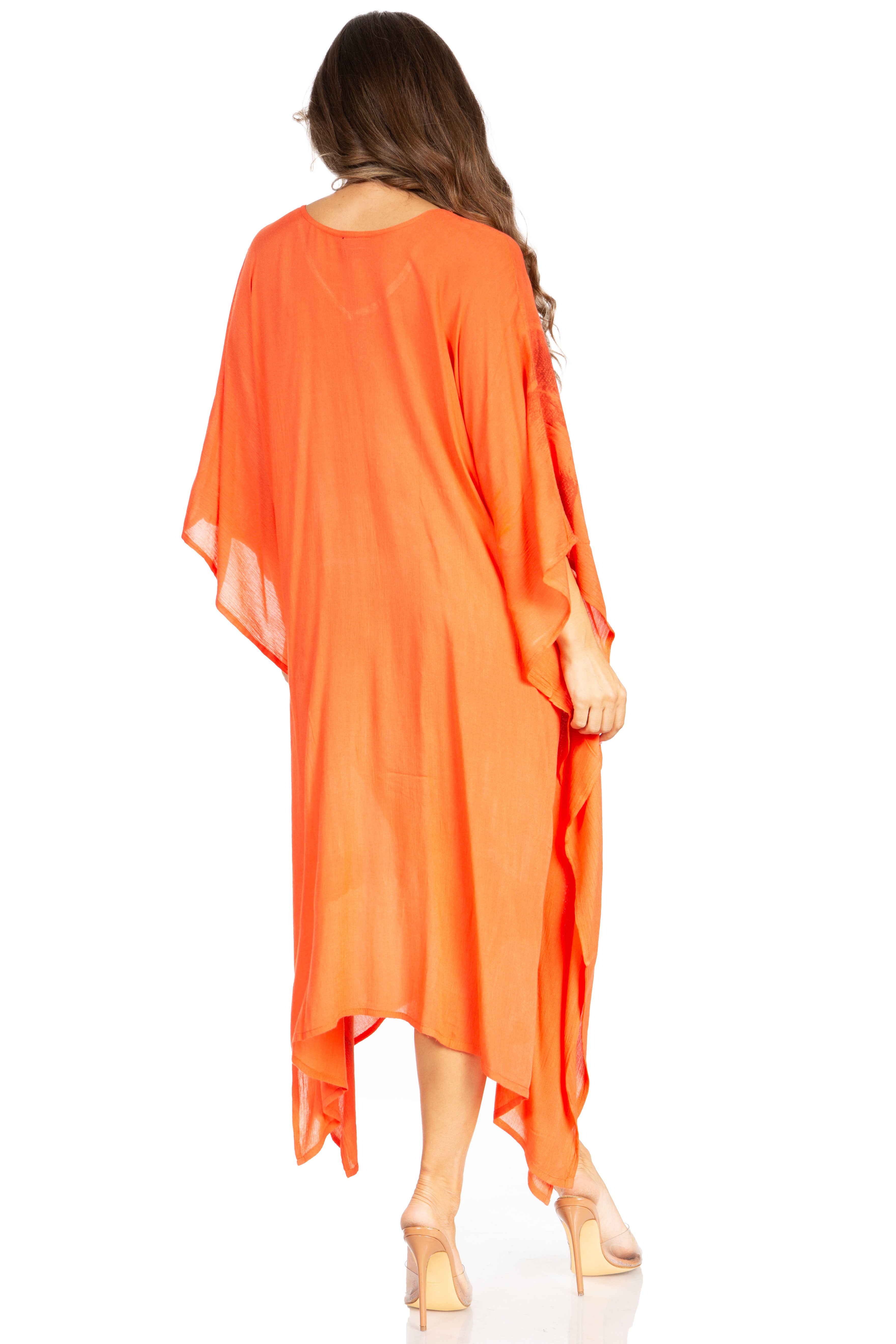 Woman wearing an orange kimono-style garment on a white background