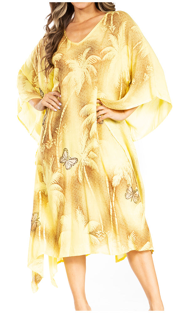 Yellow floral and butterfly patterned dress on a white background