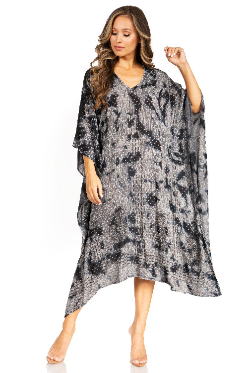 Woman wearing a black and gray floral patterned dress on a white background