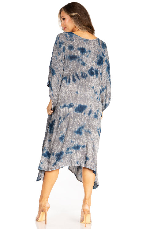 Woman wearing a tie-dye dress on a white background