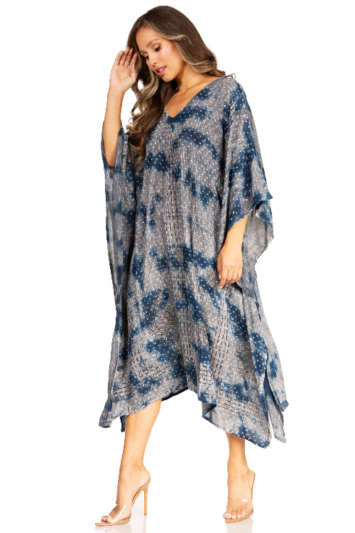 Woman wearing a blue and gray patterned dress on a white background