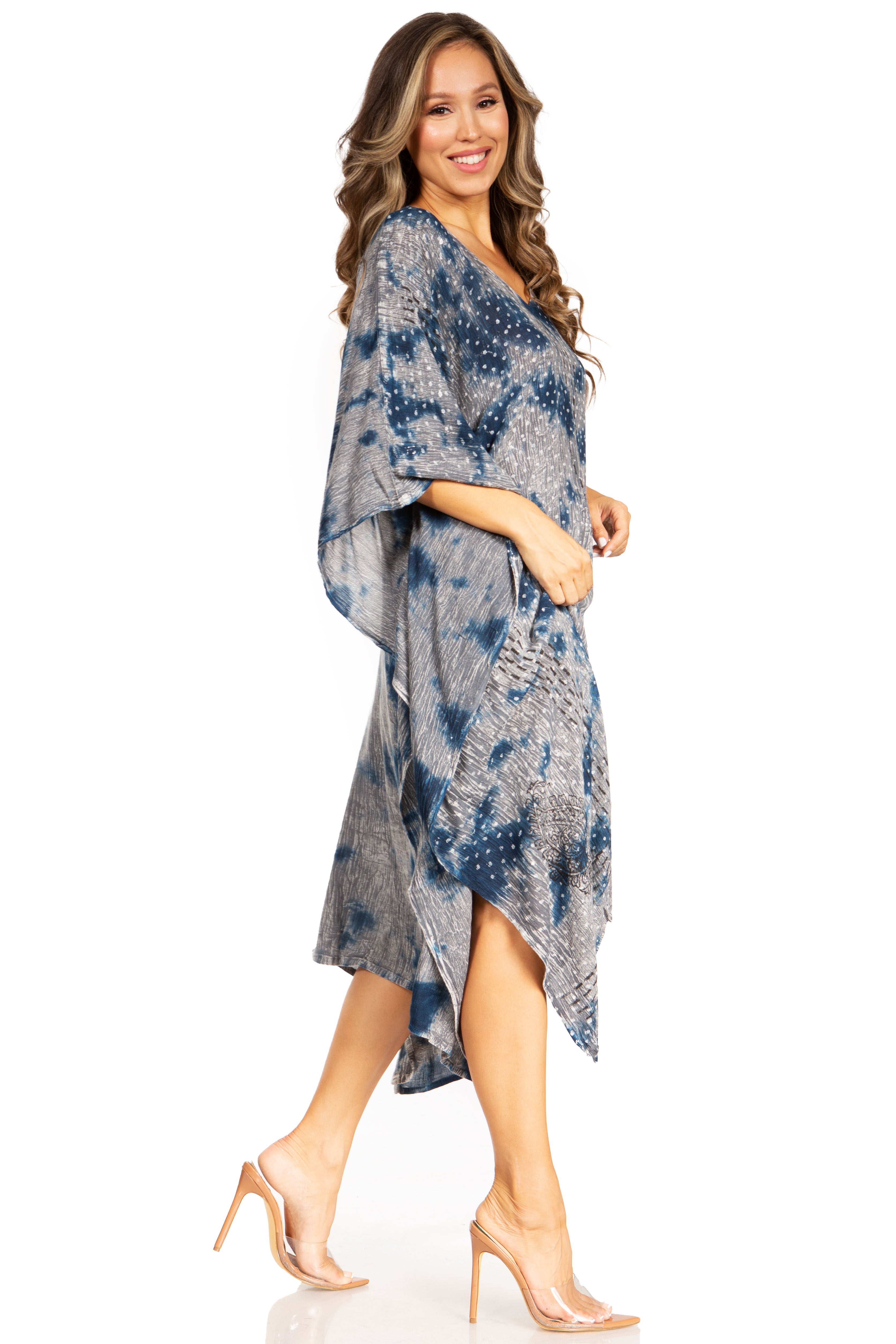 Woman wearing a blue tie-dye dress on a white background